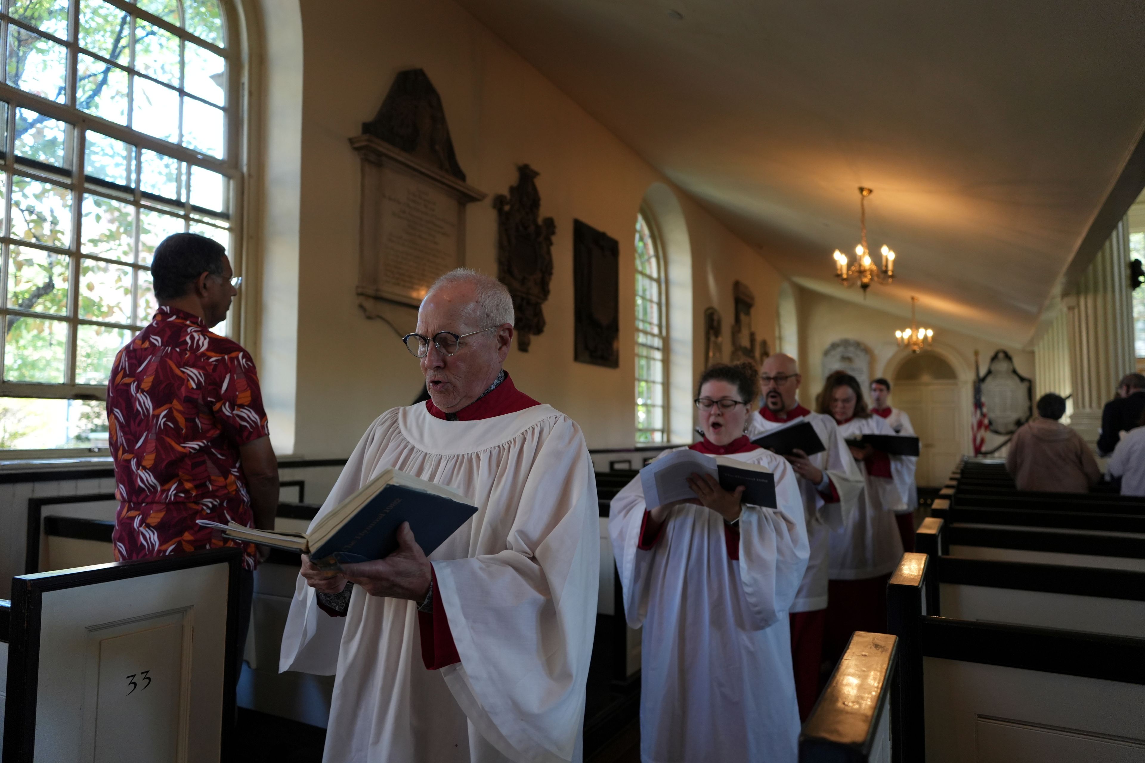 Choir members sing hymns at Christ Church in Philadelphia at a service on Sunday, Oct. 6, 2024. (AP Photo/Luis Andres Henao)