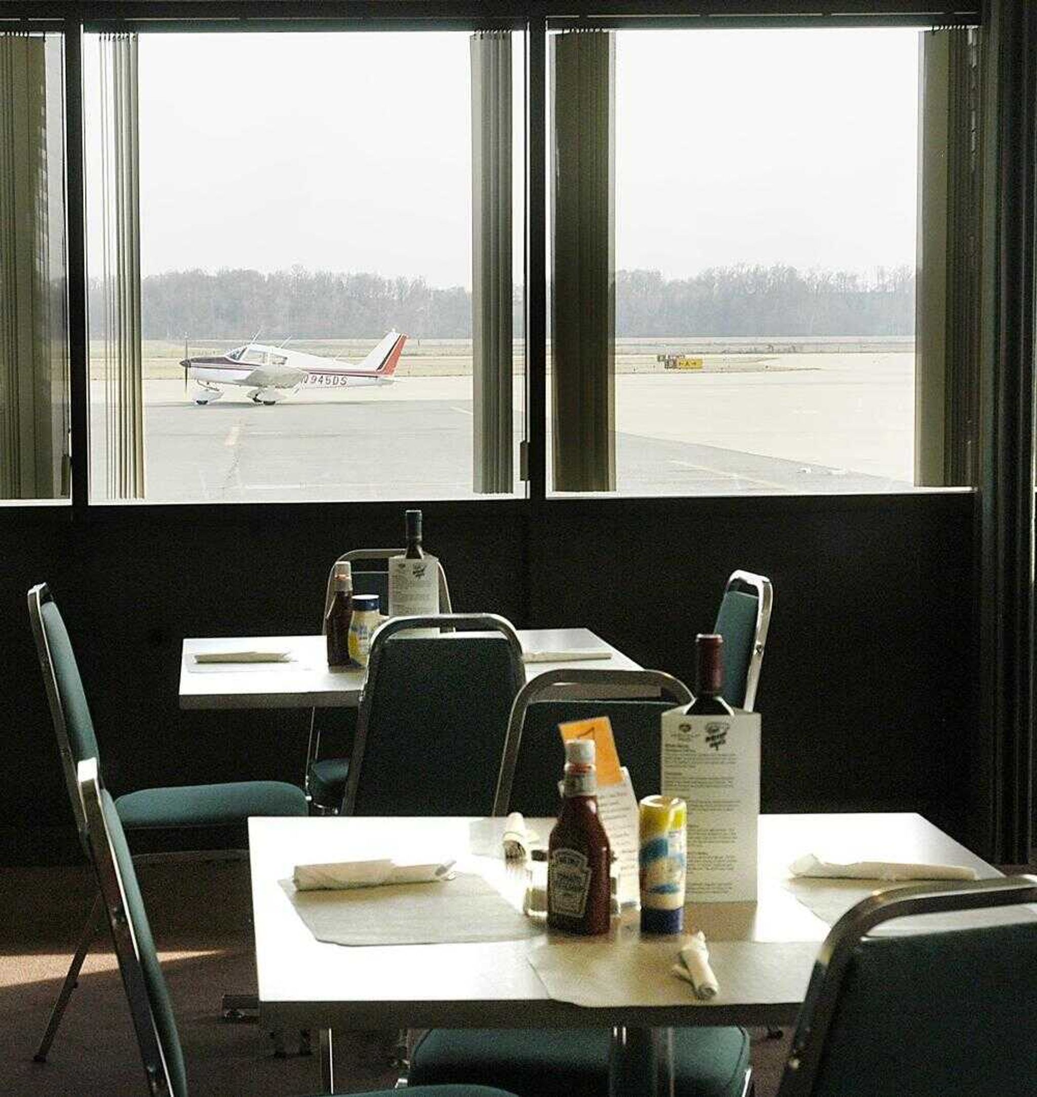 Only small commuter planes can be seen through the window of the empty airport restaurant after RegionsAir Inc. shut down indefinitely all flights in and out of Cape Girardeau Regional Airport. (Diane L. Wilson)