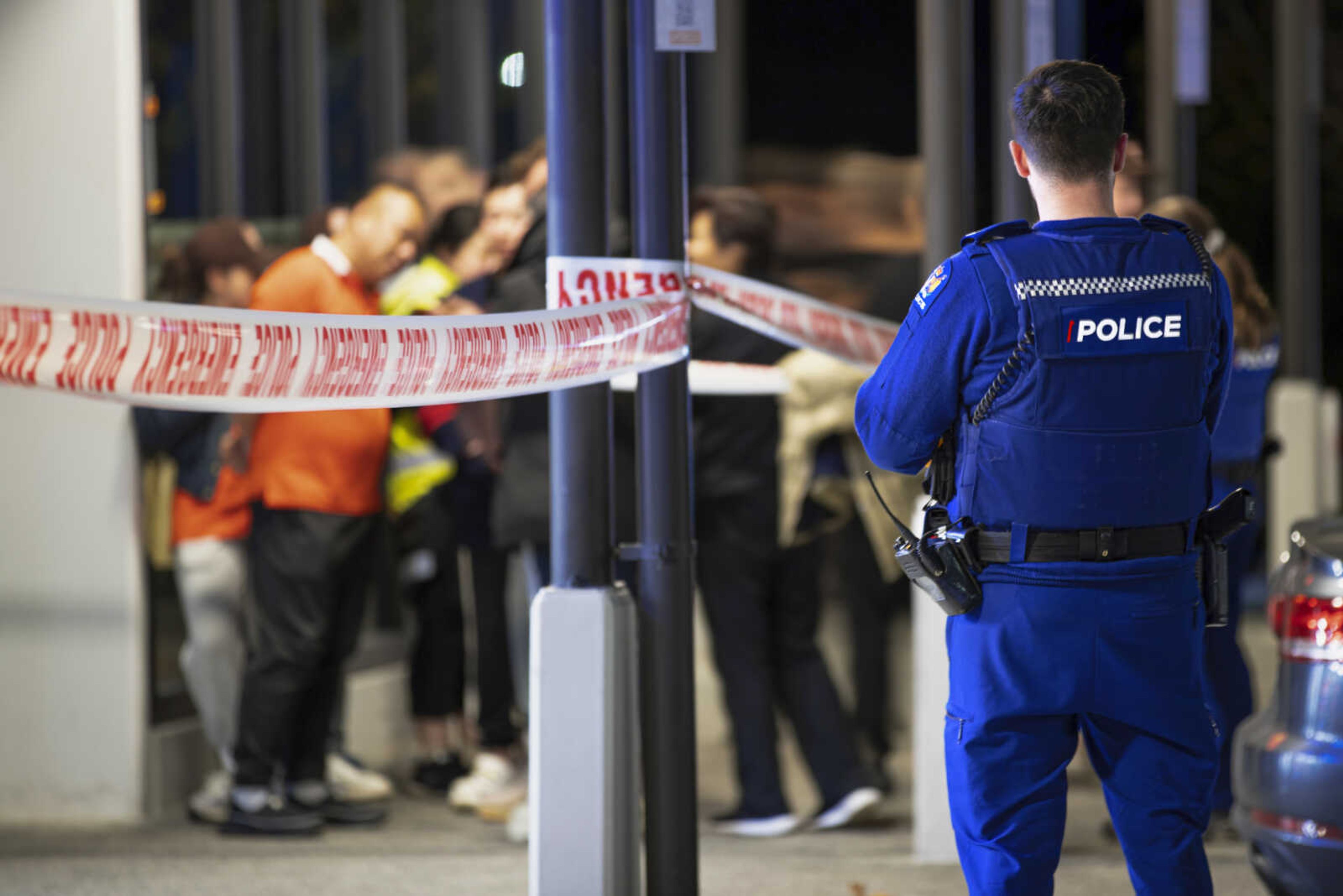 Police tape cordons off a restaurant in Auckland, New Zealand, Tuesday, June 20, 2023, after an axe attack late Monday. Multiple people were hospitalized after a man armed with an axe began attacking diners at random at three neighboring Chinese restaurants, according to police and witnesses. (Hayden Woodward/New Zealand Herald via AP)