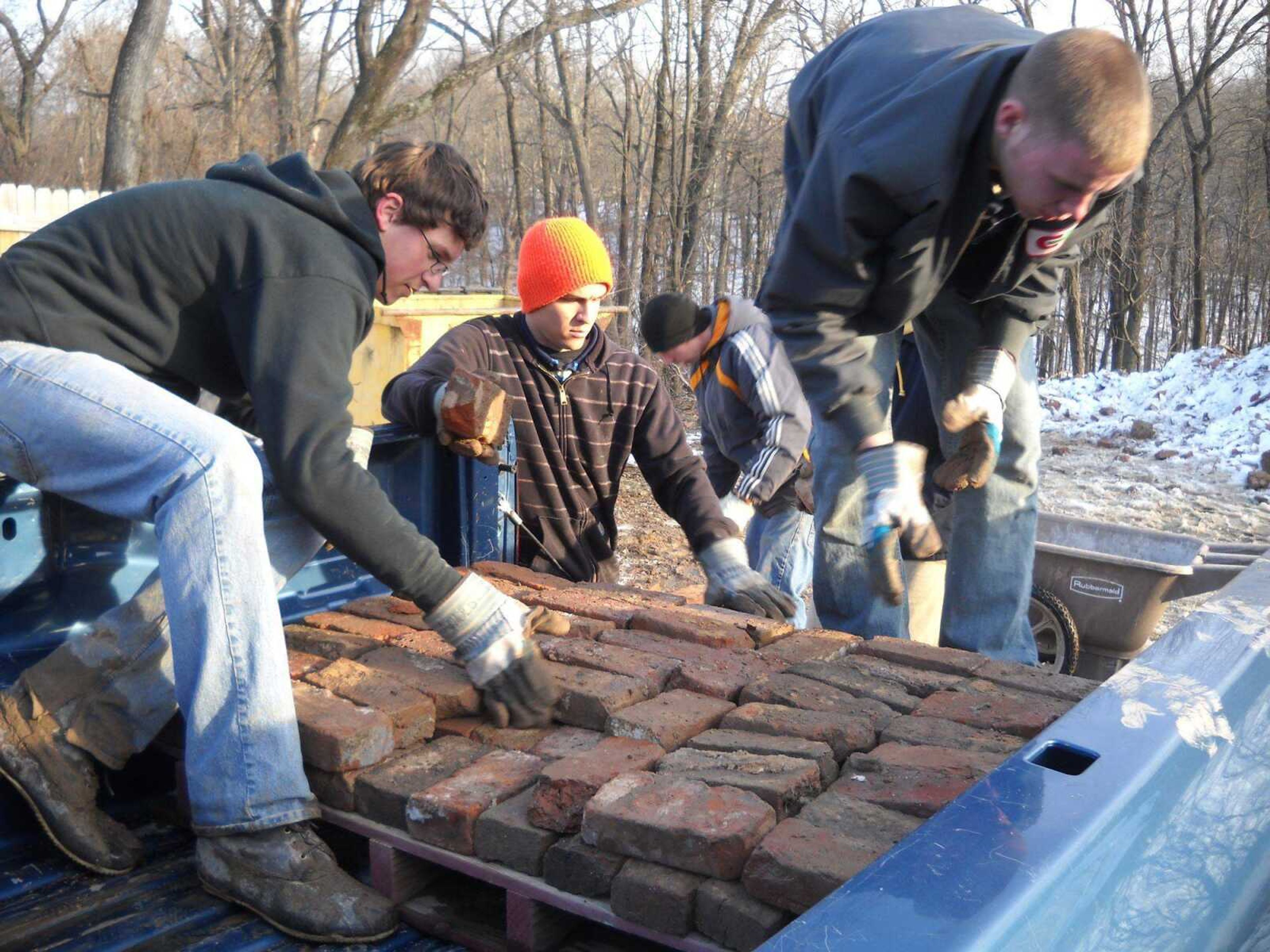 Teen Challenge Mid-America participants collect bricks that will be used to build towers for chimney swift habitats. (Submitted photo)