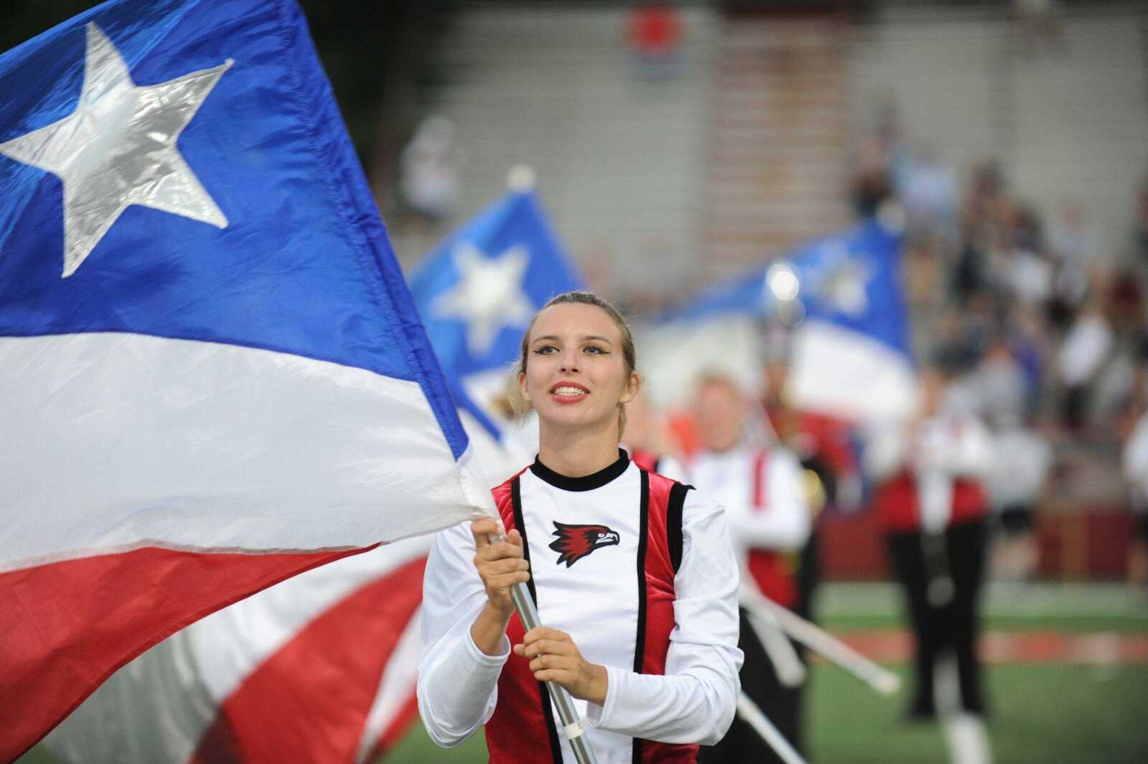 Janet Richard performs with the Southeast Missouri State's color guard before the season opener at Houck Stadium Thursday, Aug. 28, 2014. (Glenn Landberg)