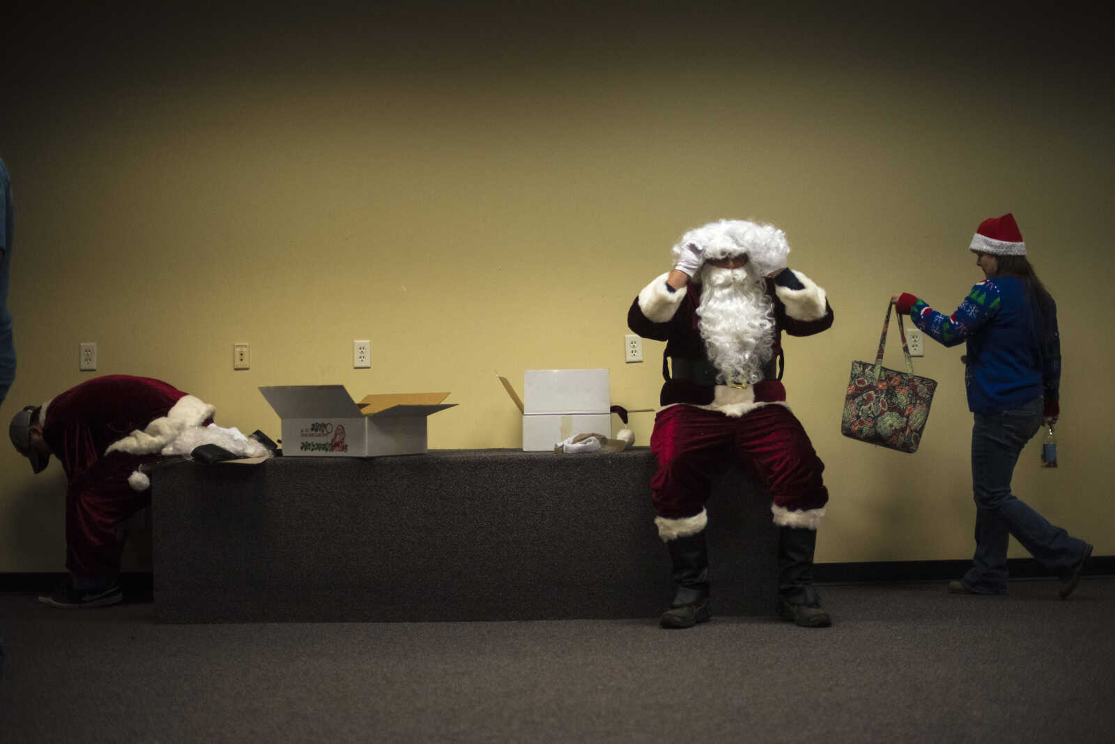 Santa's get ready during the Jaycee Toybox delivery on Thursday, Dec. 21, 2017, in Cape Girardeau.