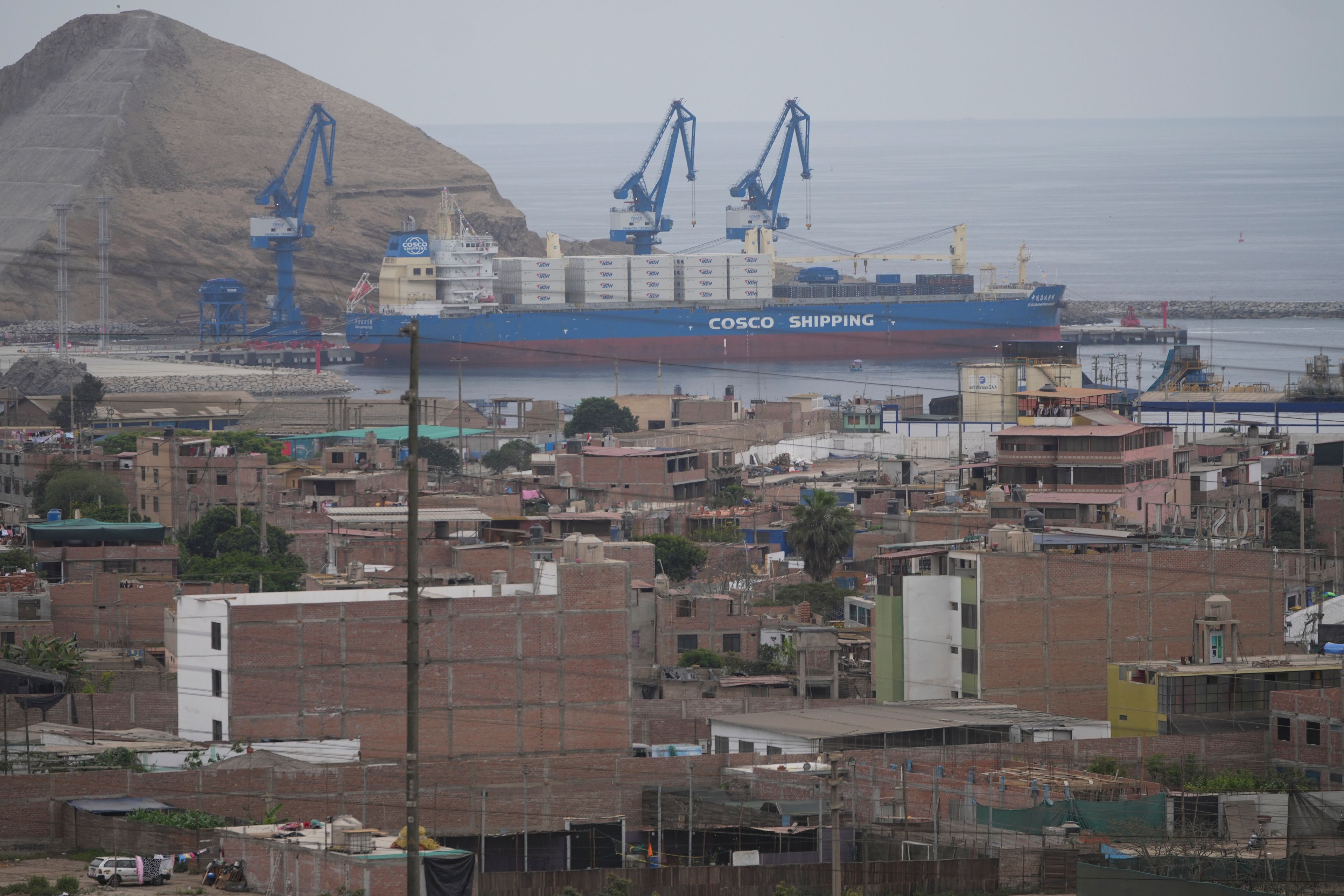 A cargo ship sits in a Chinese-funded port in Chancay, Peru, Tuesday, Nov. 12, 2024. (AP Photo/Silvia Izquierdo)