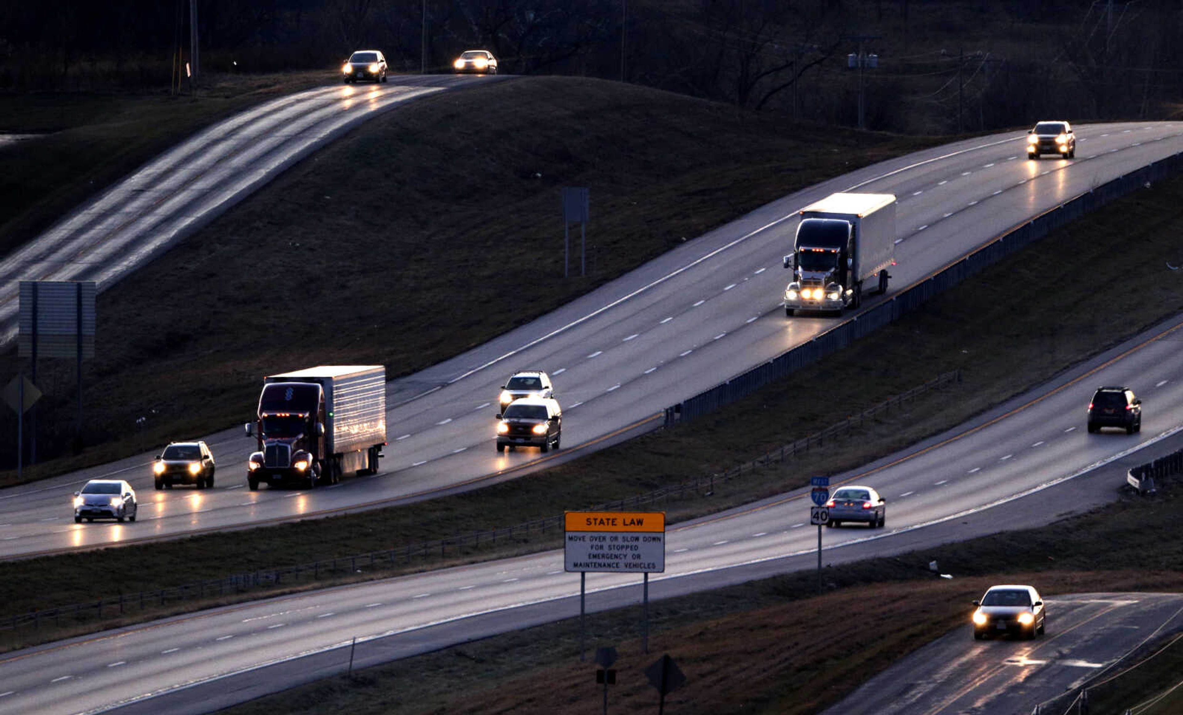 FILE - Vehicles travel along Interstate 70 near Odessa, Mo., Jan. 14, 2016. A powerful Missouri state senator on Tuesday, April 18, 2023, unveiled a $2.8 billion plan to widen Interstate 70 to at least three lanes across the state, an even more ambitious proposal than what the governor originally asked of lawmakers. (AP Photo/Charlie Riedel, File)