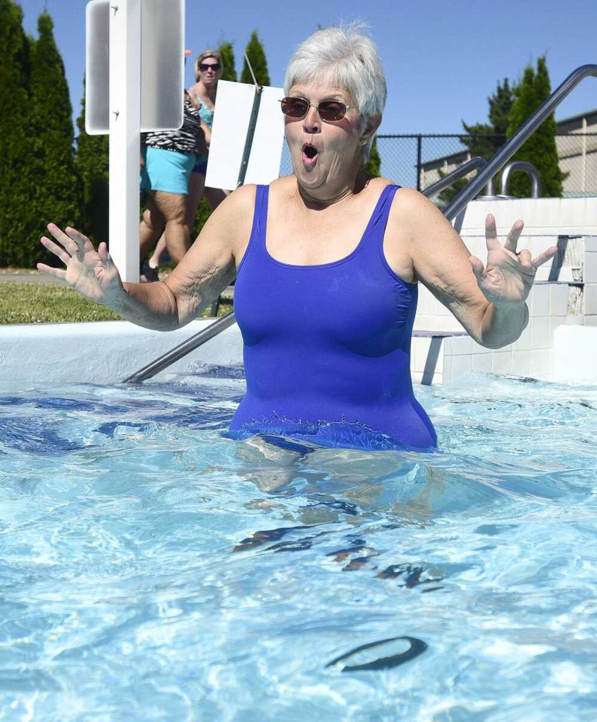 Cutline-Body Copy:Daphne Fiehler reacts to the cold water as she enters the lazy river on Monday, June 19, at Cape Splash.