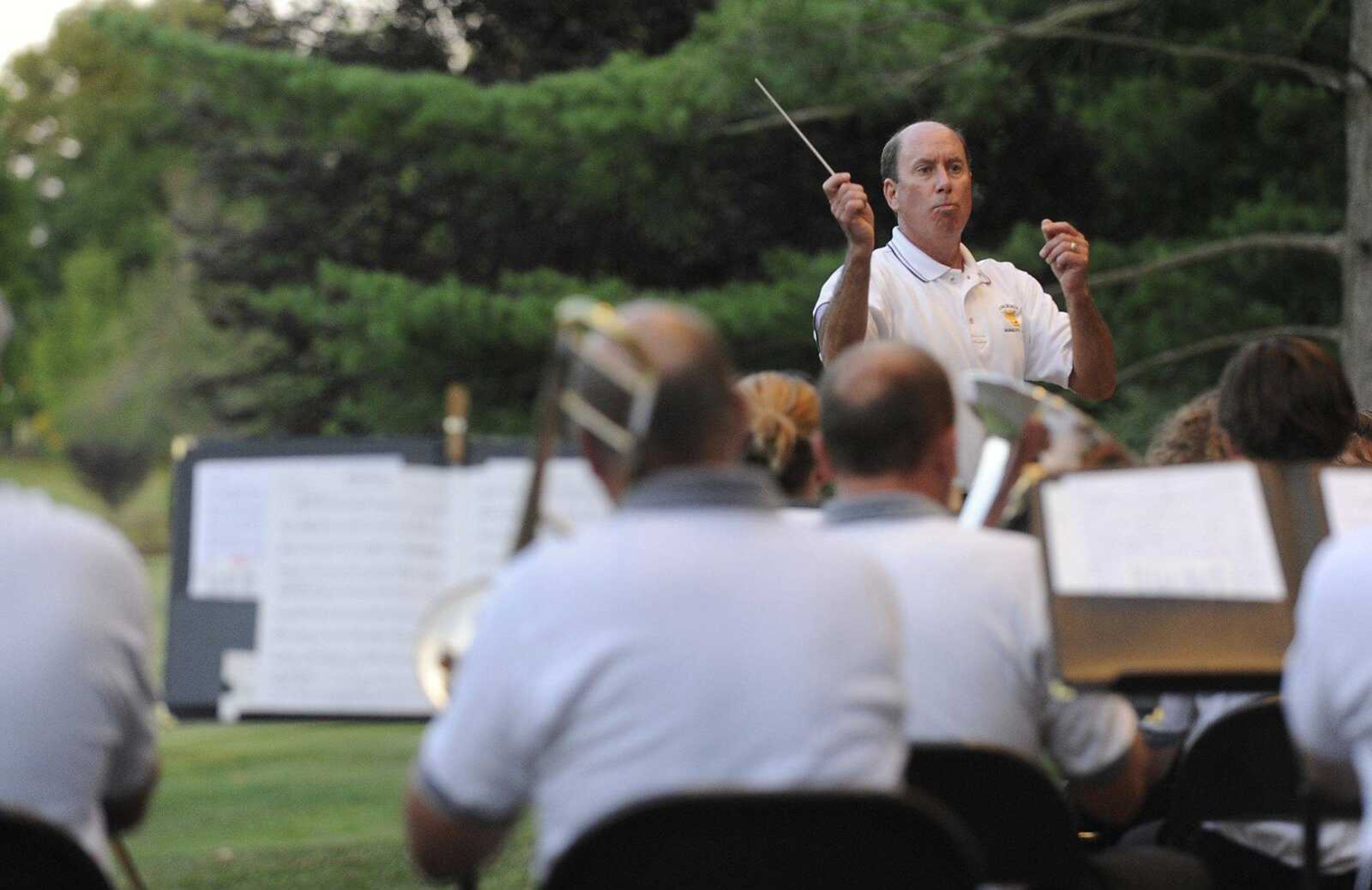 Director Scott Vangilder conducts the Jackson Municipal Band during a concert June 14, 2012, at the Jackson bandshell in Jackson City Park. (Fred Lynch)