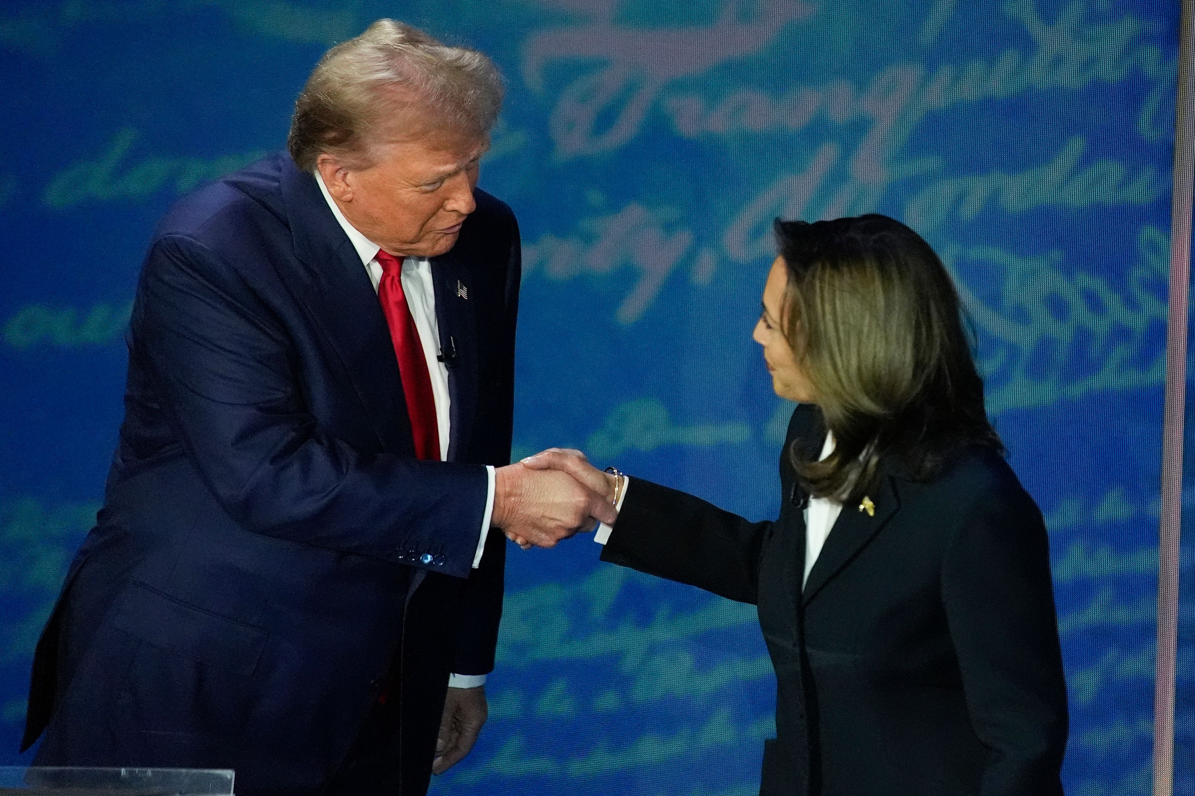 FILE - Republican presidential nominee former President Donald Trump and Democratic presidential nominee Vice President Kamala Harris shake hands before the start of an ABC News presidential debate at the National Constitution Center, Sept. 10, 2024, in Philadelphia. (AP Photo/Alex Brandon, File)