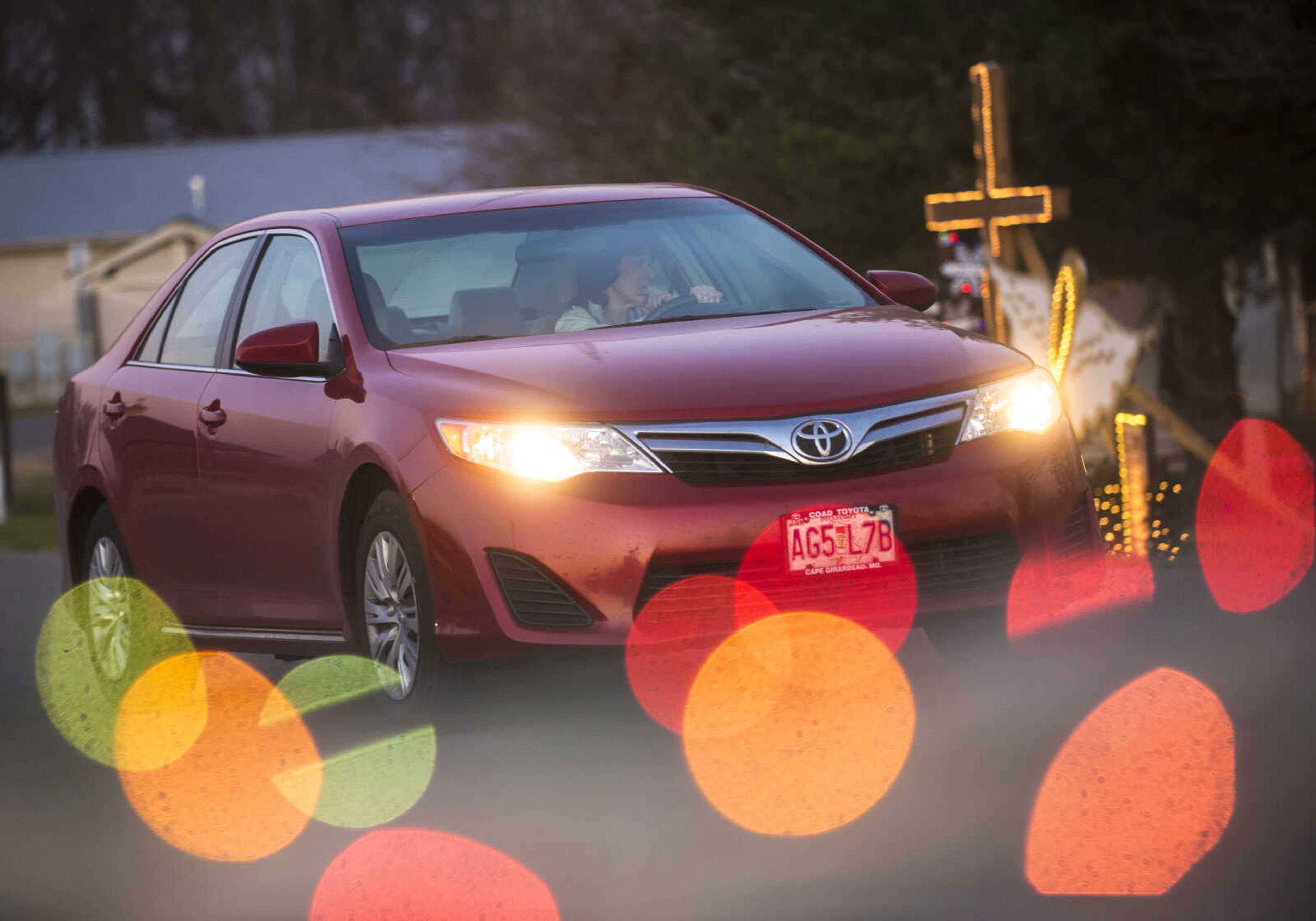 A car drives slowly passed the Holiday of Lights Display Wednesday, Dec. 13, 2017 at Cape Girardeau County Park.