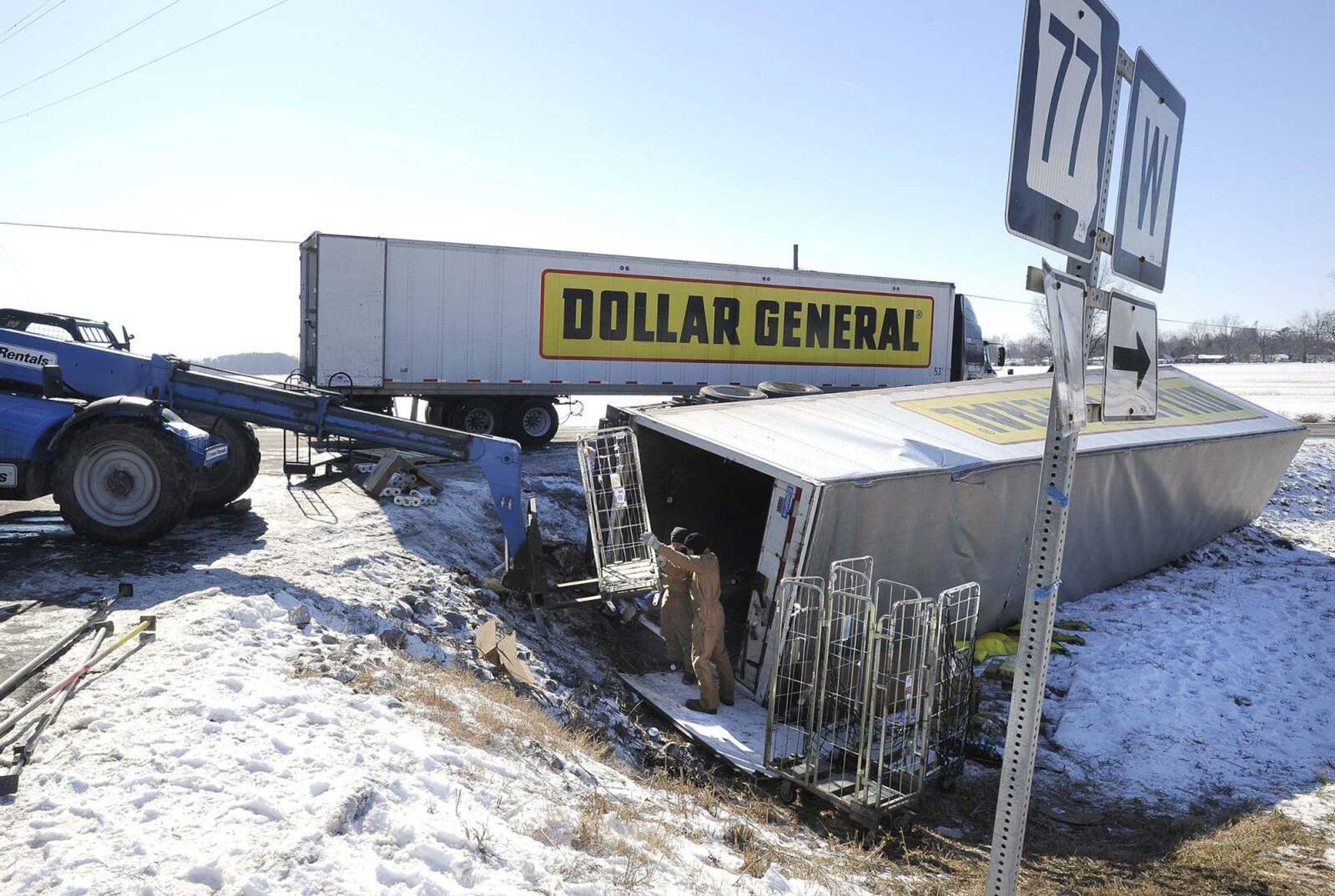 Cleanup of an overturned tractor-trailer continues Wednesday at the northeast edge of Oran, Missouri. On Monday night, the truck hauling merchandise for Dollar General slid off the road while turning right onto Route W from Highway 77. The merchandise retrieval began Tuesday, and a wrecker waited as the remaining items were removed before lifting the trailer.