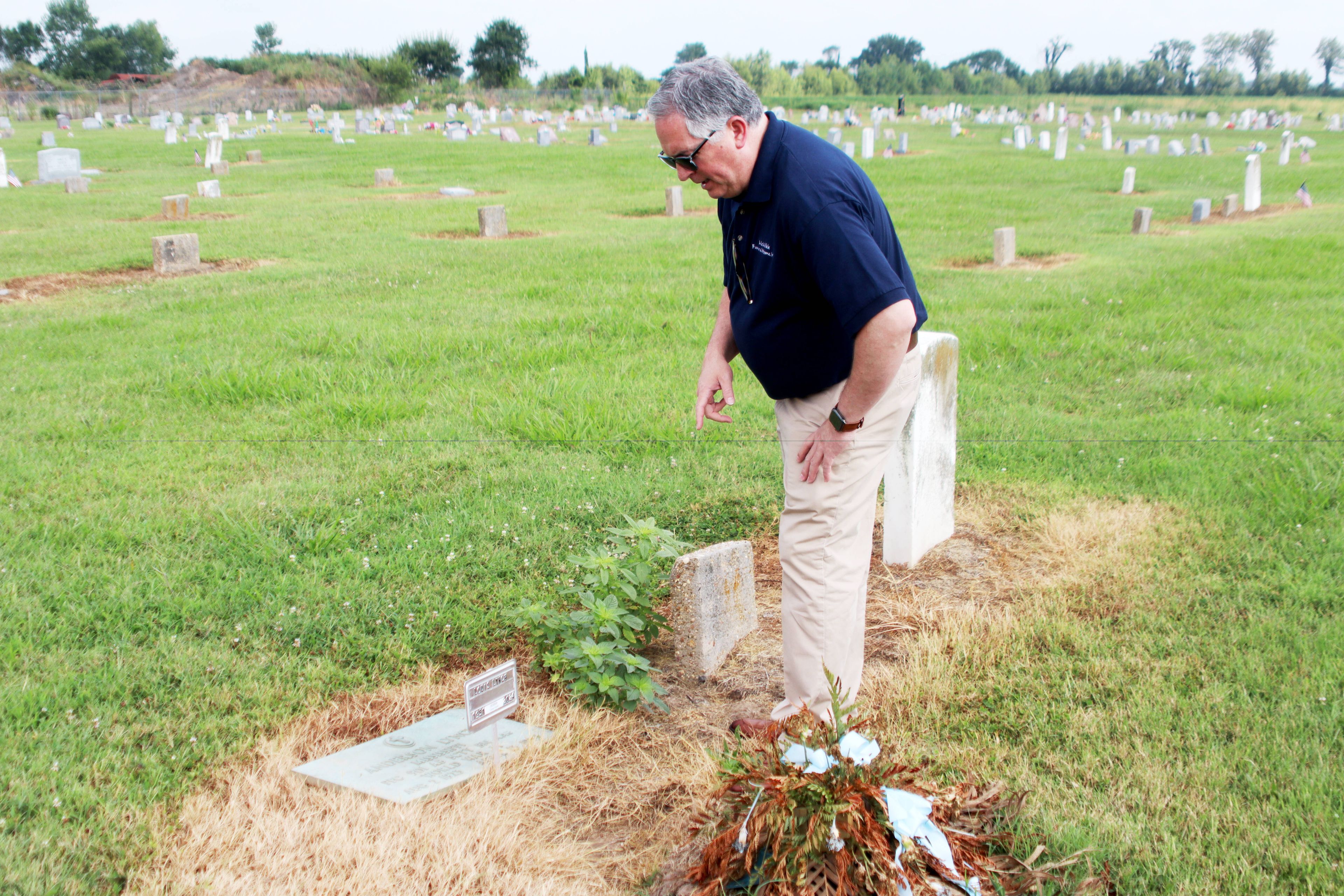 Funeral home director reunites father, son after grave sunk into the ground