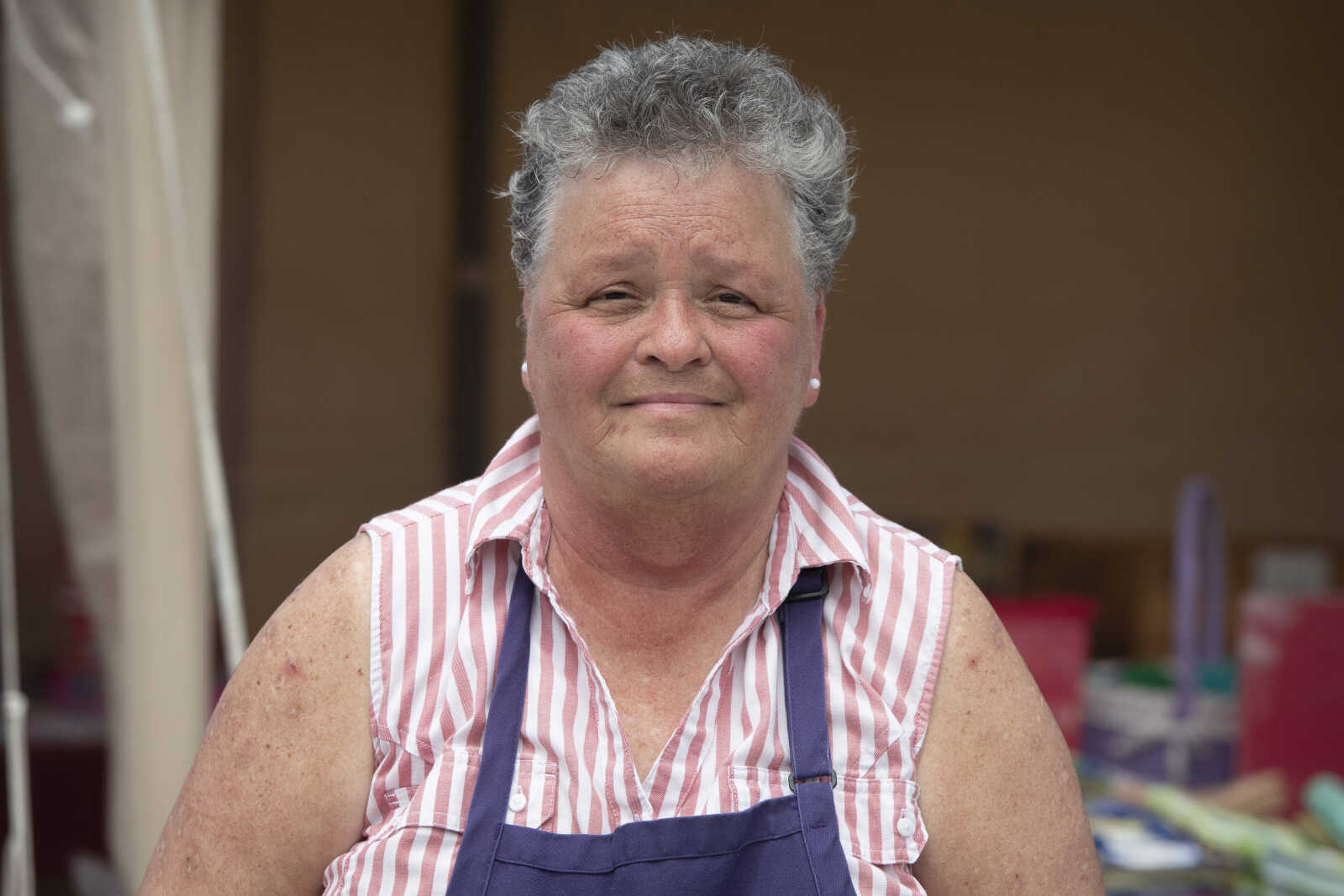 Judy Scherer of Benton, Missouri, poses for a photo at a sale in Delta during the 100-Mile Yard Sale on Saturday, May 23, 2020, along Highway 25.&nbsp;