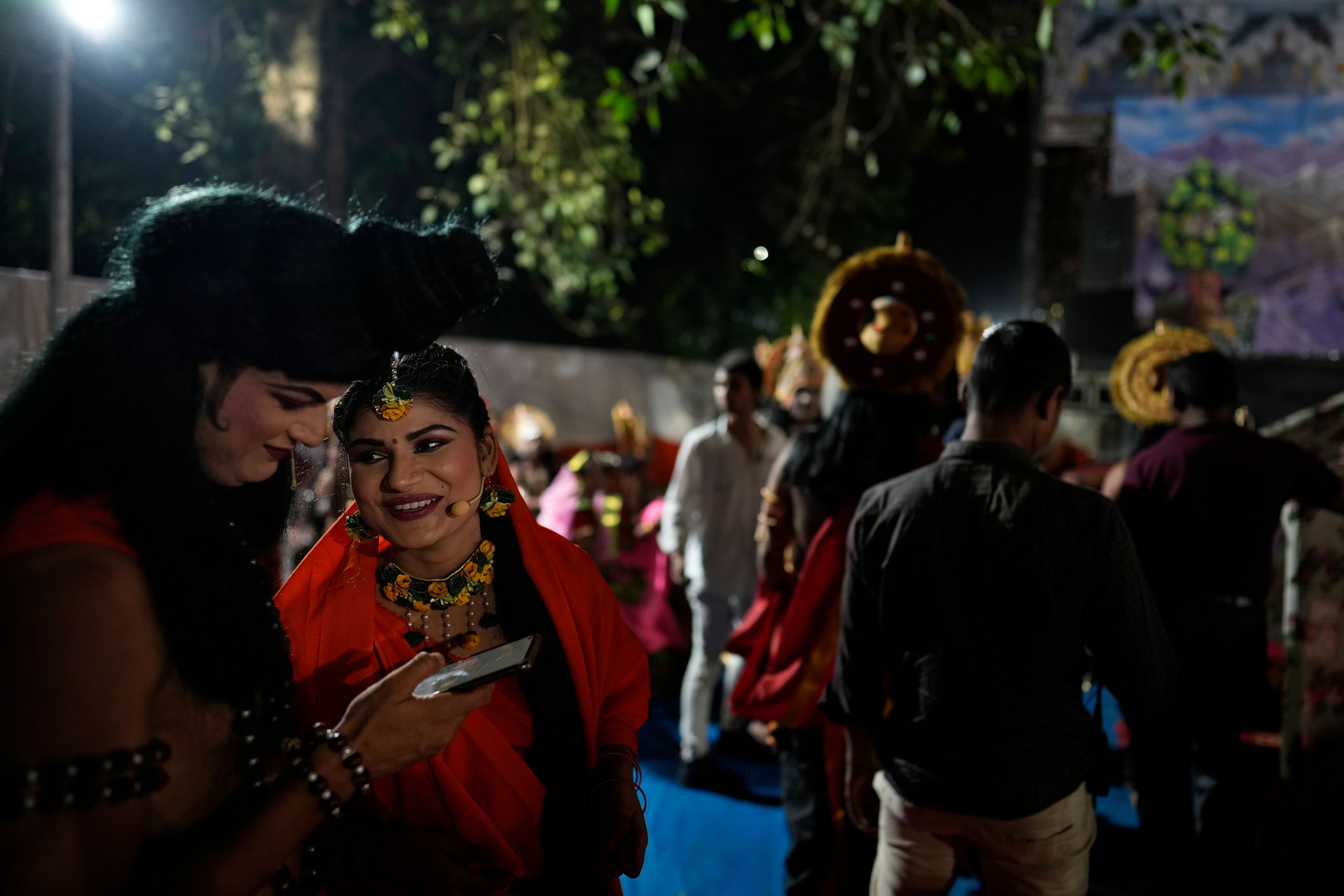 Ashutosh Agnihotri, 23, playing the character of Hindu god Rama, left, talks to Hitanshi Jha, 21, playing the character of Sita backstage during Ramleela, a dramatic folk re-enactment of the life of Rama according to the ancient Hindu epic Ramayana, in New Delhi, India, Tuesday, Oct. 8, 2024. (AP Photo/Manish Swarup)