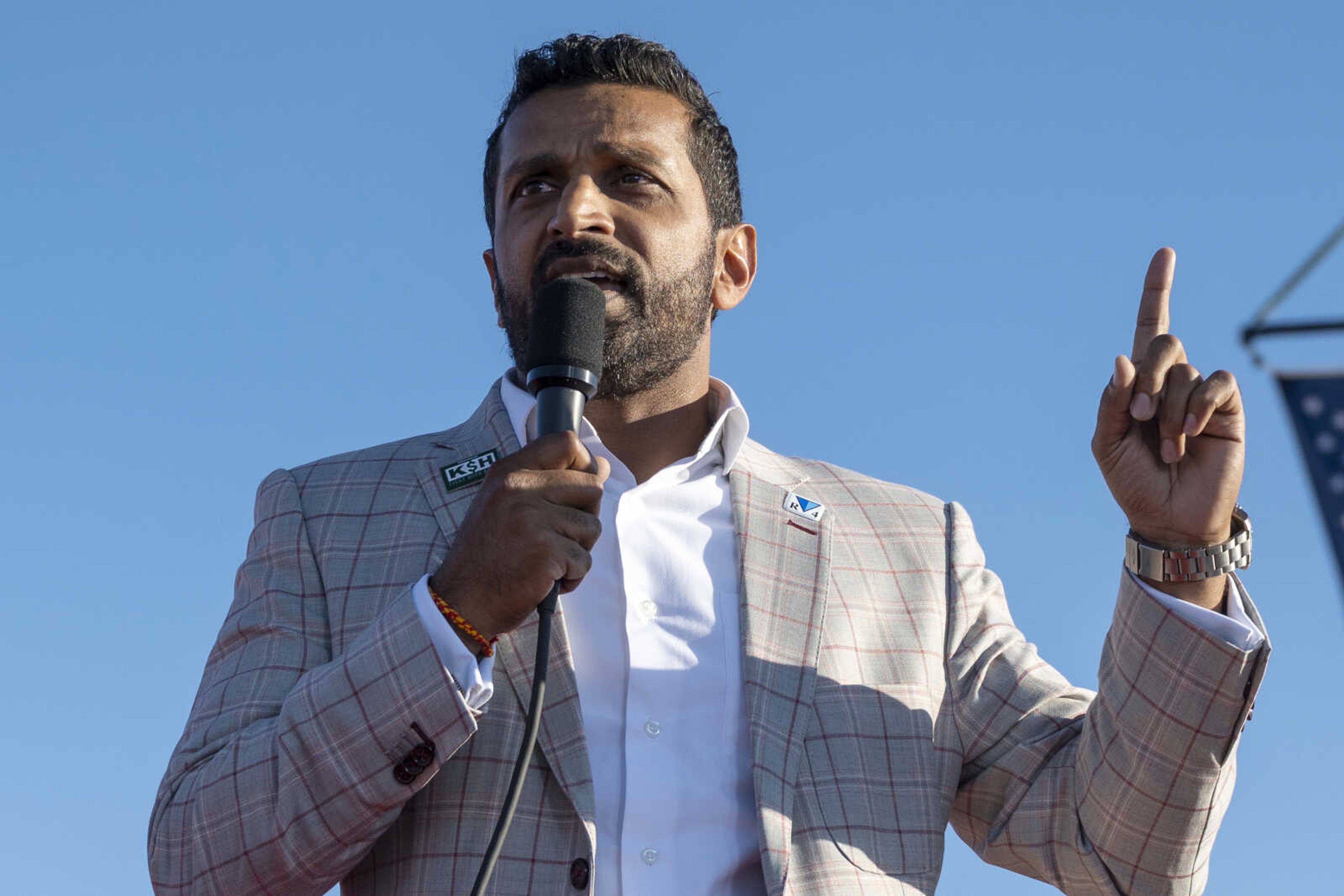 FILE - Kash Patel speaks at a rally in Minden, Nev., Oct. 8, 2022. Patel, said Tuesday, Dec. 5, 2023, that if the former president is elected again, his administration will retaliate against people in the media  criminally or civilly.  Patel said on Steve Bannon's podcast that a future administration would  go out and find the conspirators not just in government, but in the media  over the 2020 presidential election. (AP Photo/Jose Luis Villegas, File)