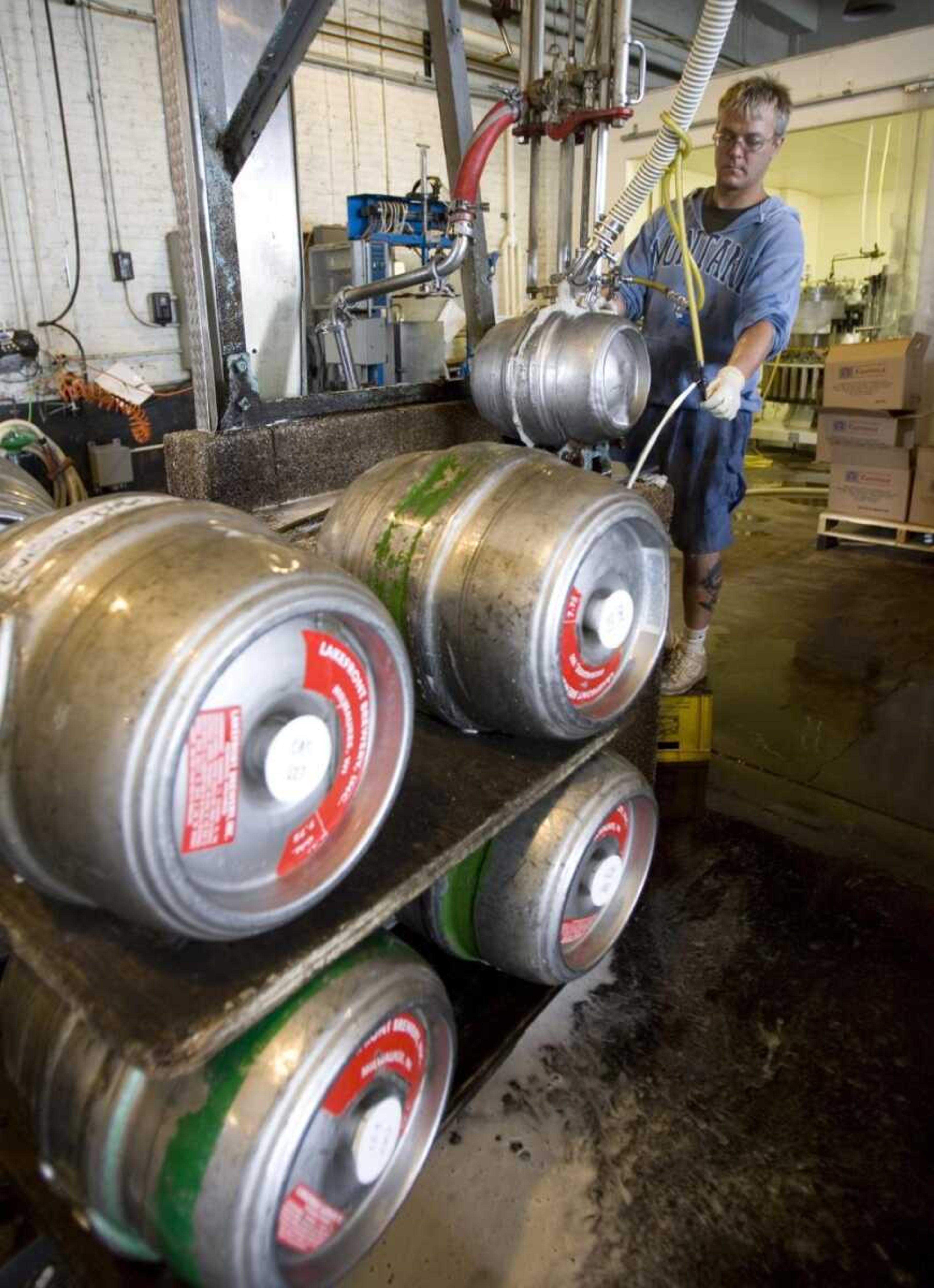 Shawn Moebius puts beer in a keg at the Lakefront Brewery, Thursday, June 28, 2007, in Milwaukee. With metal prices rising, beer makers say they expect to lose hundreds of thousands of kegs and millions of dollars this year as those stainless steel holders of brew are stolen and sold for scrap. (AP Photo/Morry Gash)