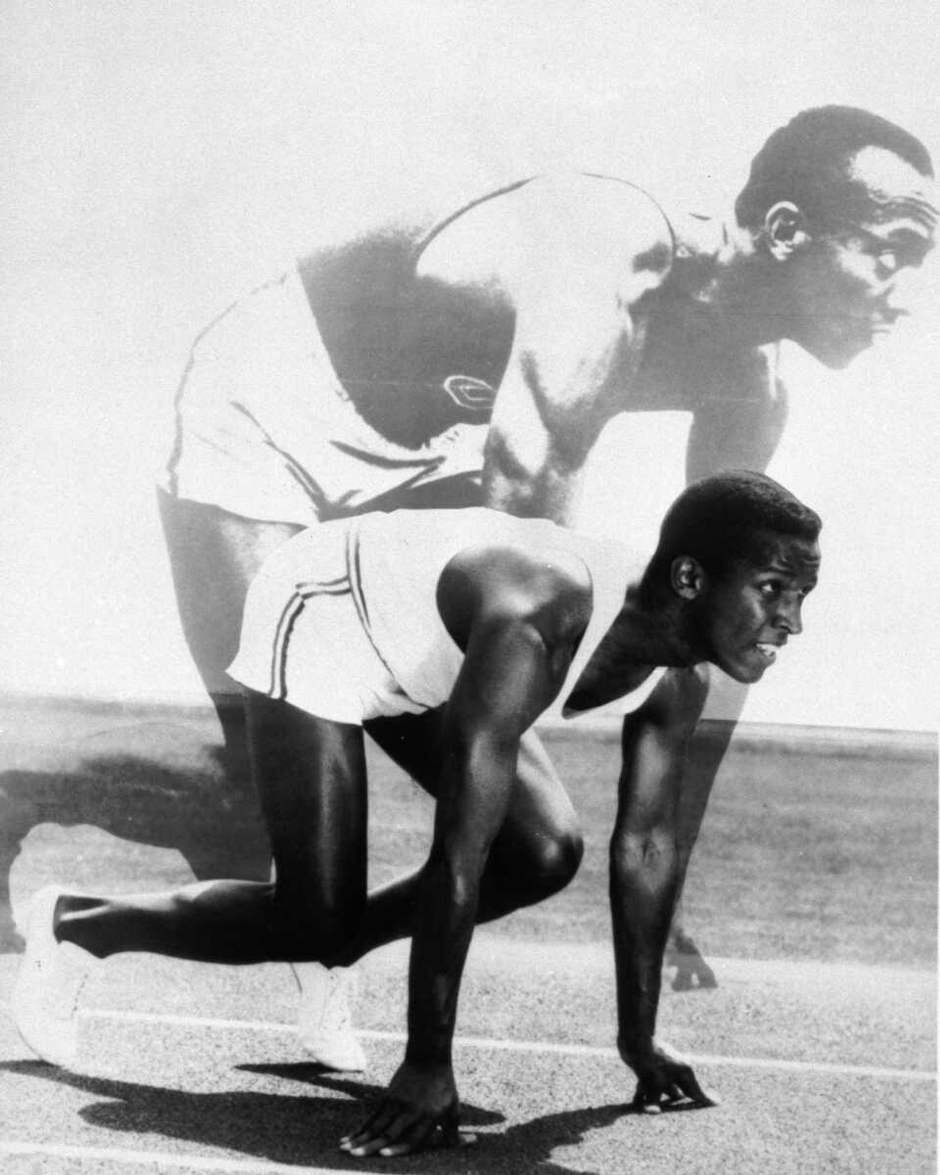 FILE-This undated file photo released by Paramount shows Dorian Harewood,foreground, striking a pose similar to Olympic track champ Jesse Owens,background.(AP Photo/Paramount)**NO SALES**