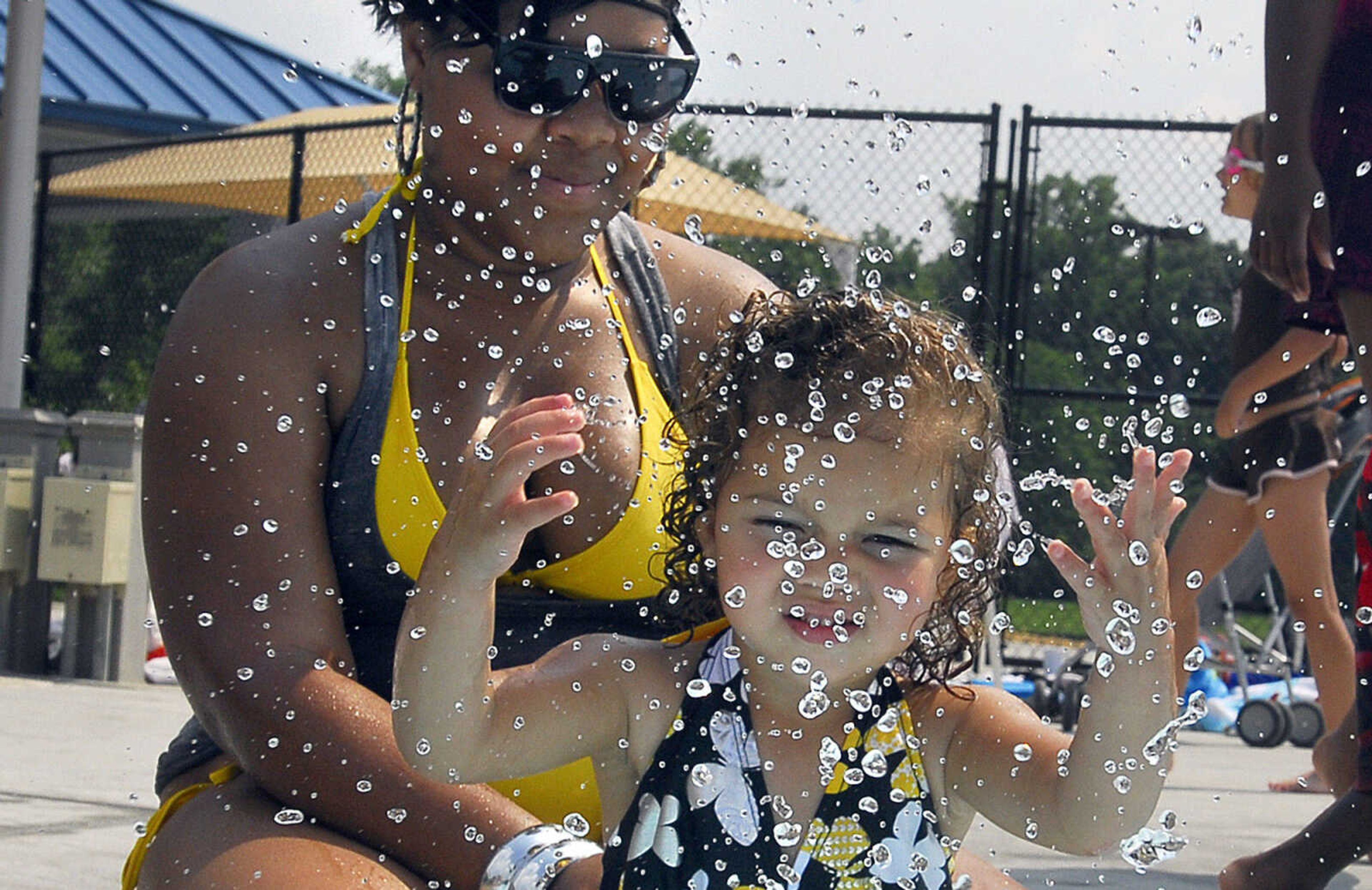 LAURA SIMON~lsimon@semissourian.com
Two-year-old Nylah Hunt splashes in the play pool area as her aunt Aerial Brown keeps a watchful eye on her Saturday, May 29, 2010 at Cape Splash.