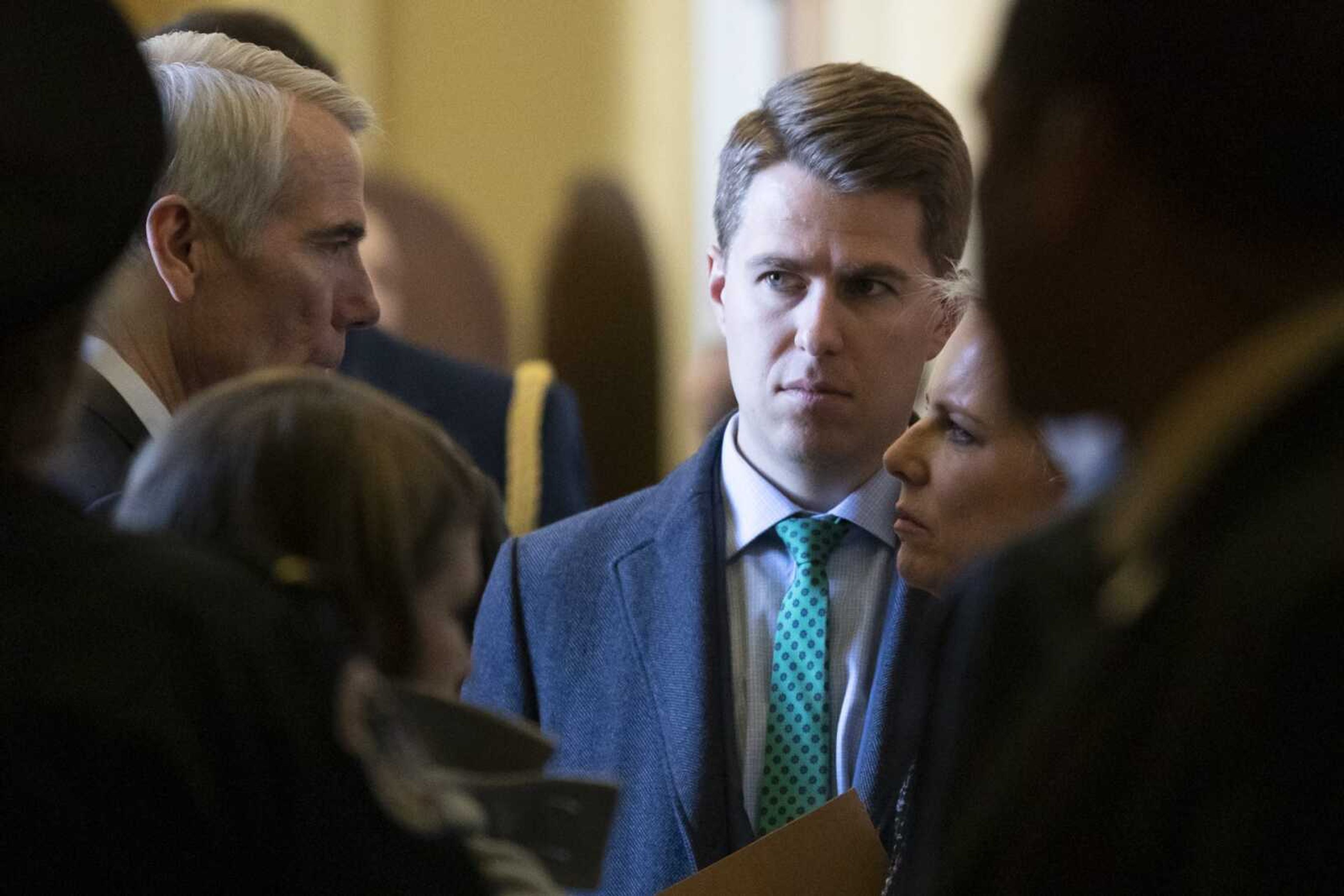 Sen. Rob Portman, R-Ohio, left, talks with Homeland Security Secretary Kirstjen Nielsen, right, and her chief of staff Miles Taylor after the Republican Caucus luncheon March 5, 2019, on Capitol Hill in Washington. Taylor, who penned a scathing anti-Trump op-ed and book under the pen name "Anonymous," made his identify public Oct. 28, 2020.