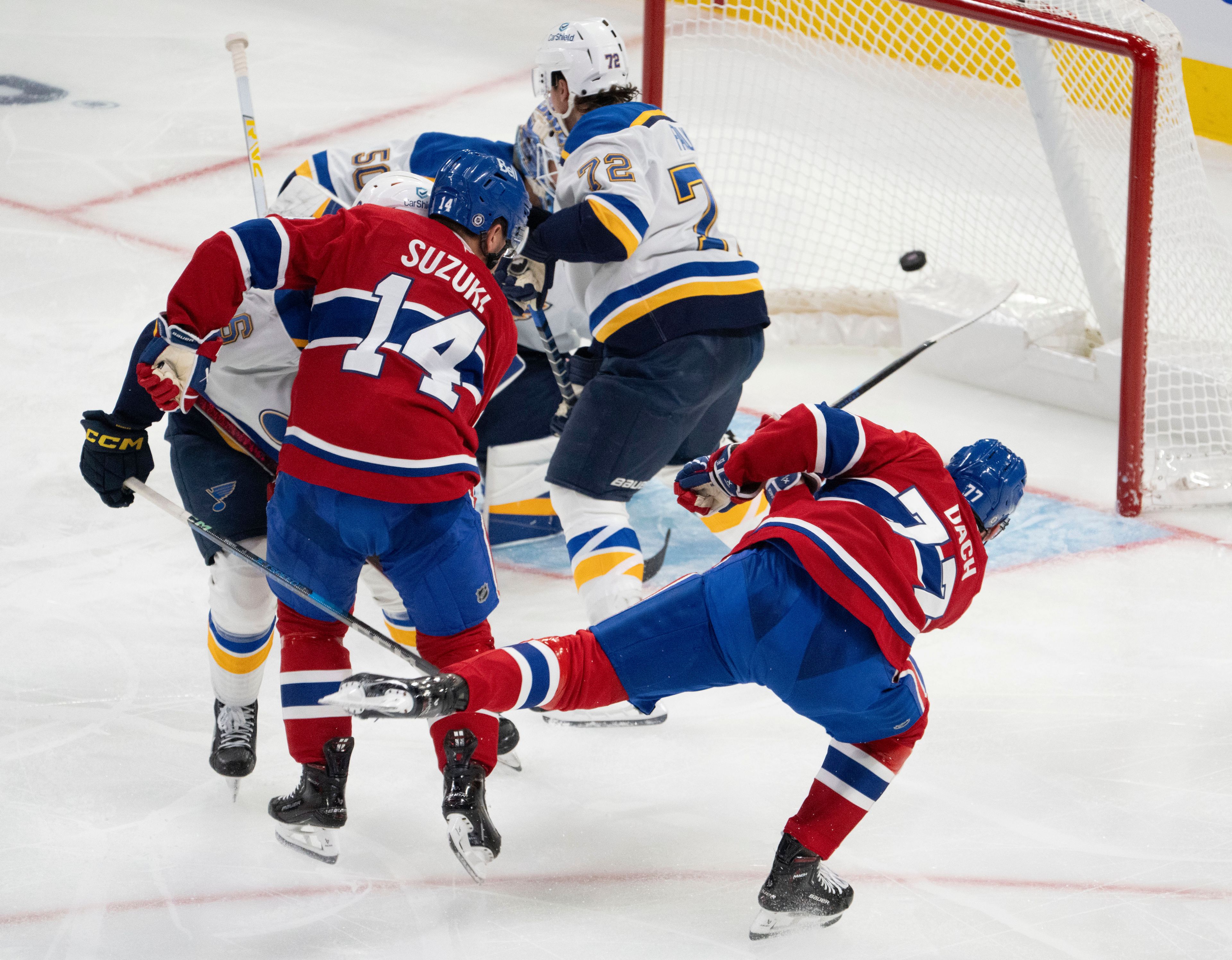 Montreal Canadiens' Kirby Dach (77) scores against St. Louis Blues goaltender Jordan Binnington (50) during second period NHL hockey action Saturday, October 26, 2024 in Montreal. (Ryan Remiorz/The Canadian Press via AP)