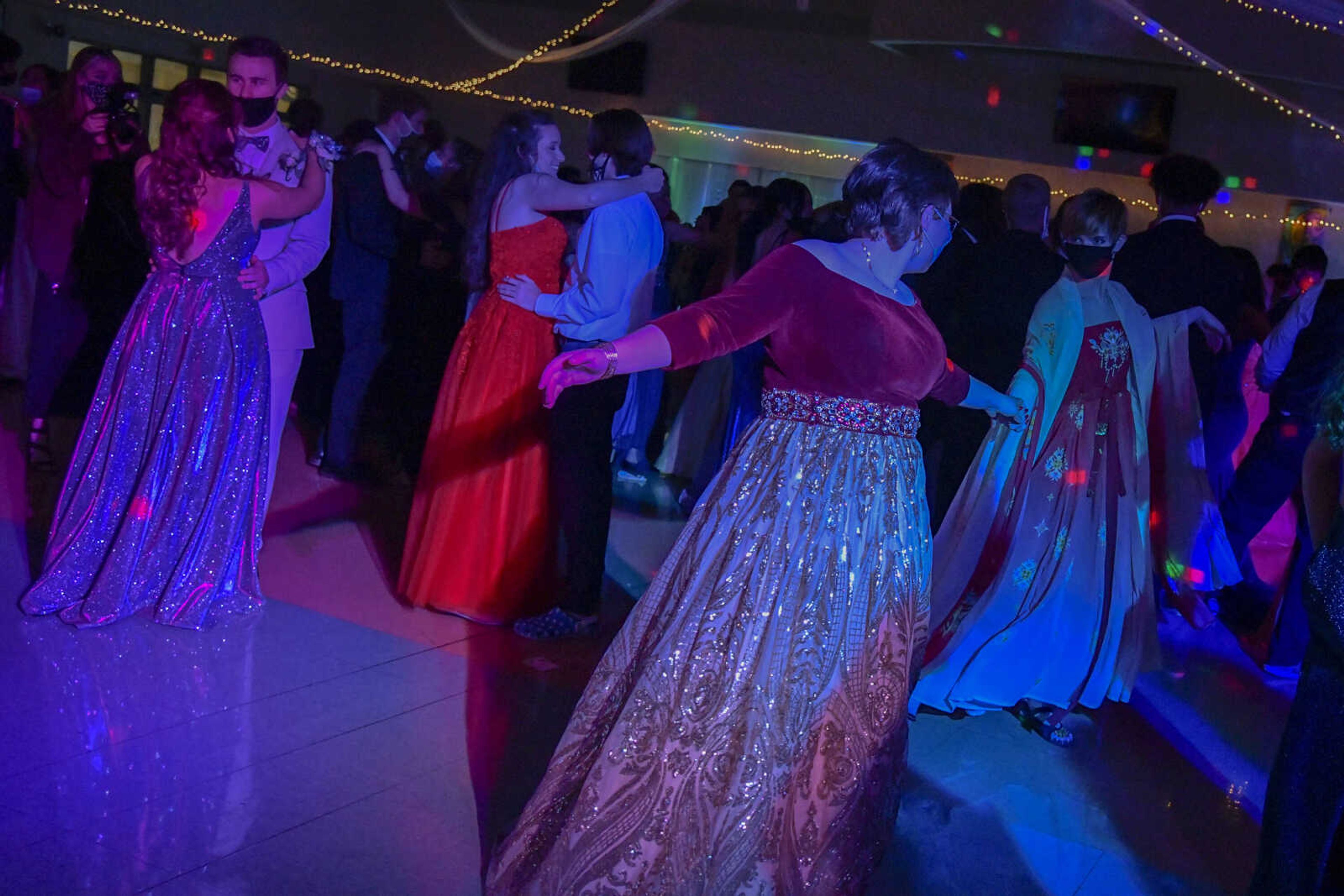 Couples dance to a slow song during the prom at Cape Central High School in Cape Girardeau on Saturday, May 8, 2021.