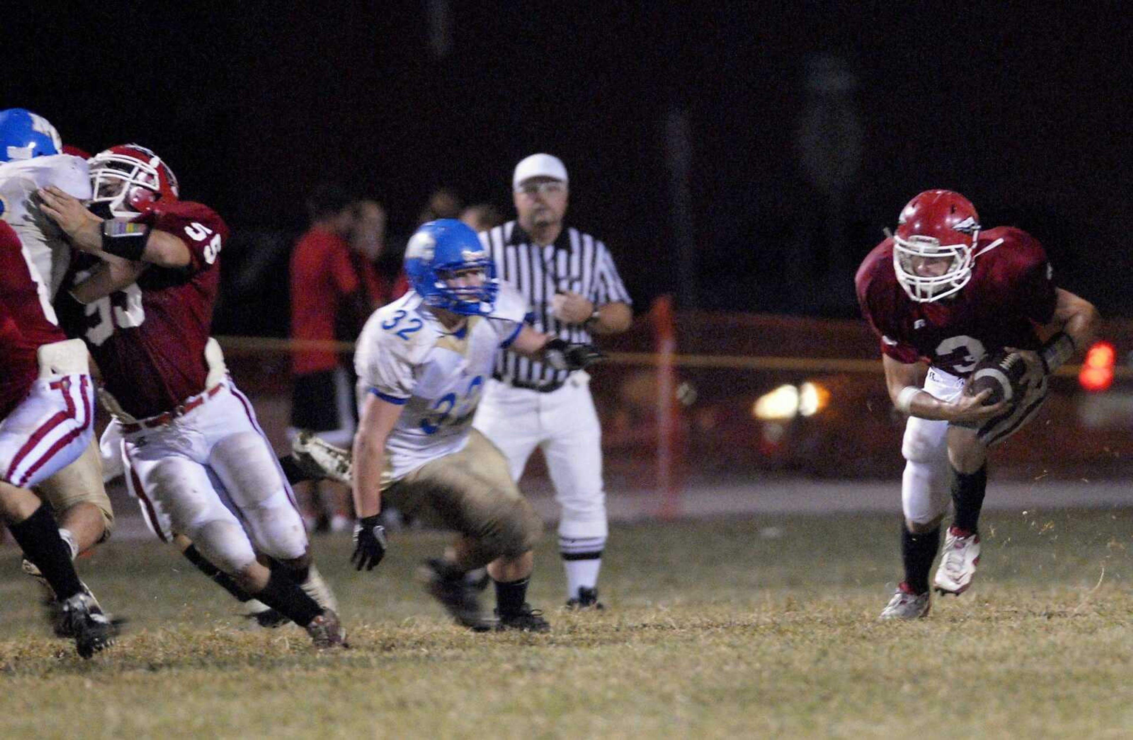 Jackson running back Ethan Ruch moves downfield past North County's Joe Swofford as Jackson's Michael Riney blocks during the third quarter of a game on Friday, Sept. 10, 2010, in Jackson. Jackson defeated North County 17-0. (Kristin Eberts)