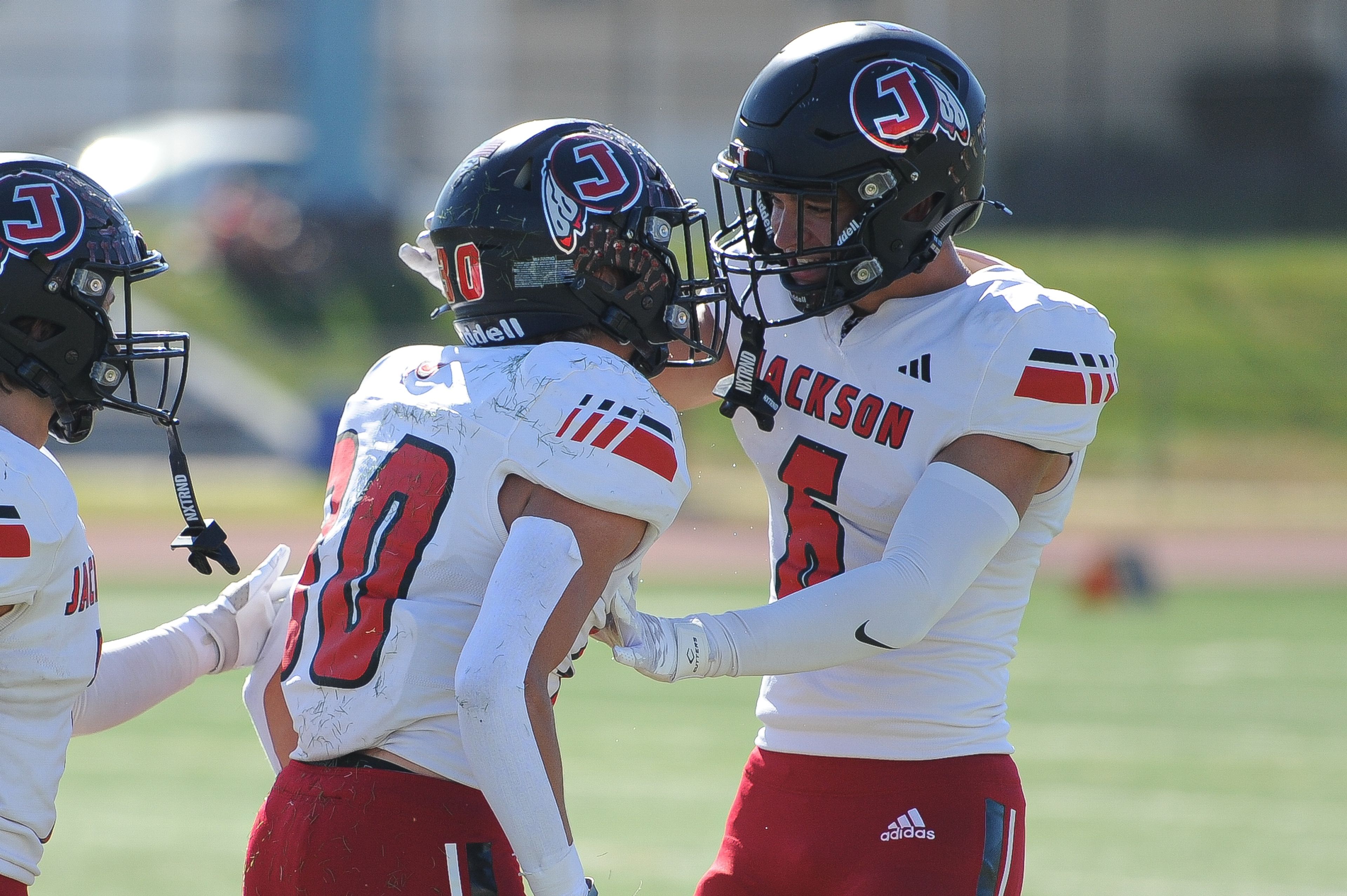 Jackson's Gavin Alspaugh (right) celebrates with teammate Lukas Cox (left) during a Saturday, October 19, 2024 game between the Miller Career/Vashon Phoenix and the Jackson Indians at Gateway STEM High School in St. Louis. Jackson defeated Miller Career, 55-14.