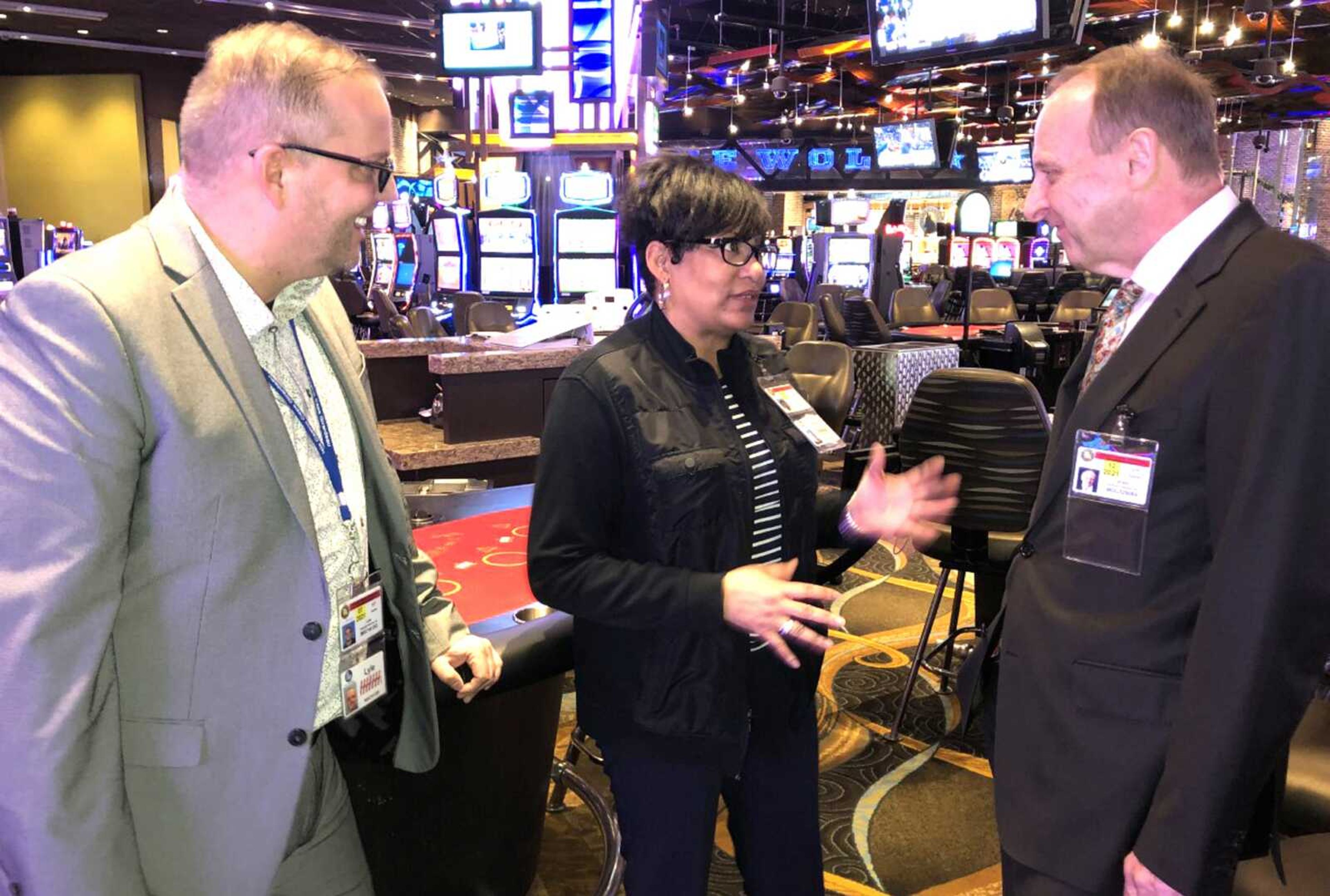 Century Casino Cape Girardeau pit manager Avon Hill, left, meets with Century Casinos chairman and co-CEO Erwin Haitzmann last week on the casino floor.