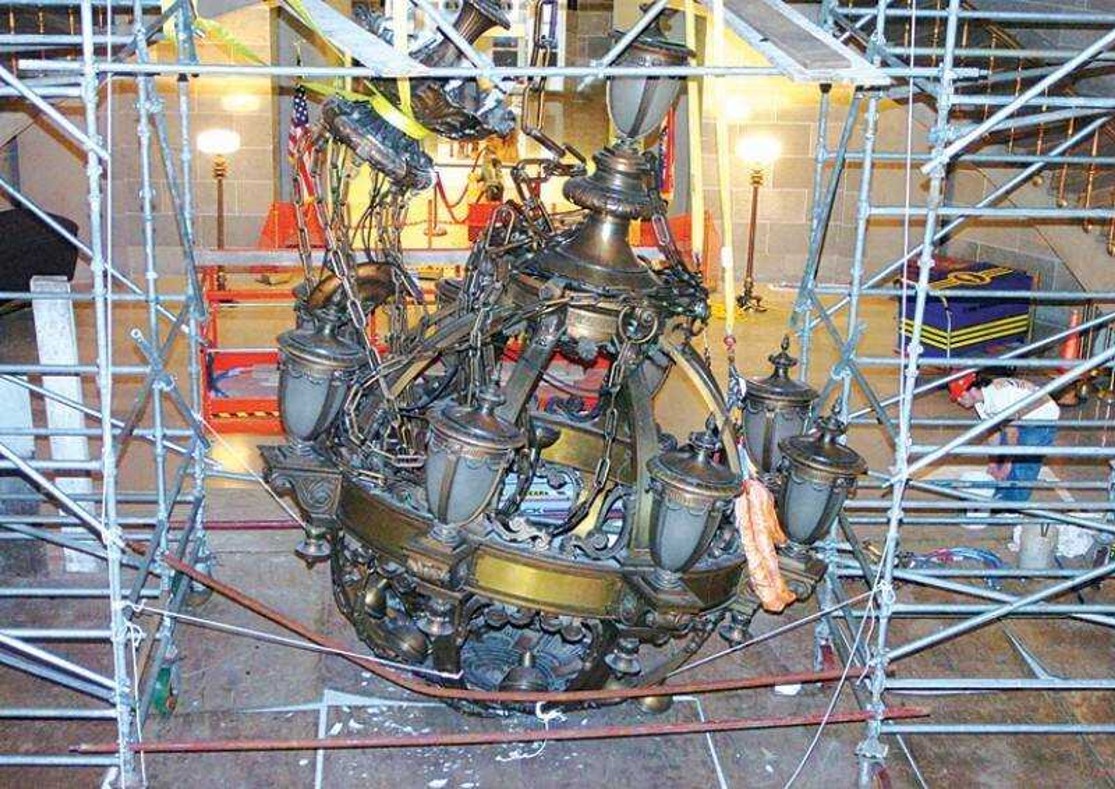 Workmen looked over the situation at the Capitol in Jefferson City, Mo., Saturday. The chandelier fell several feet Friday evening. (News Tribune)