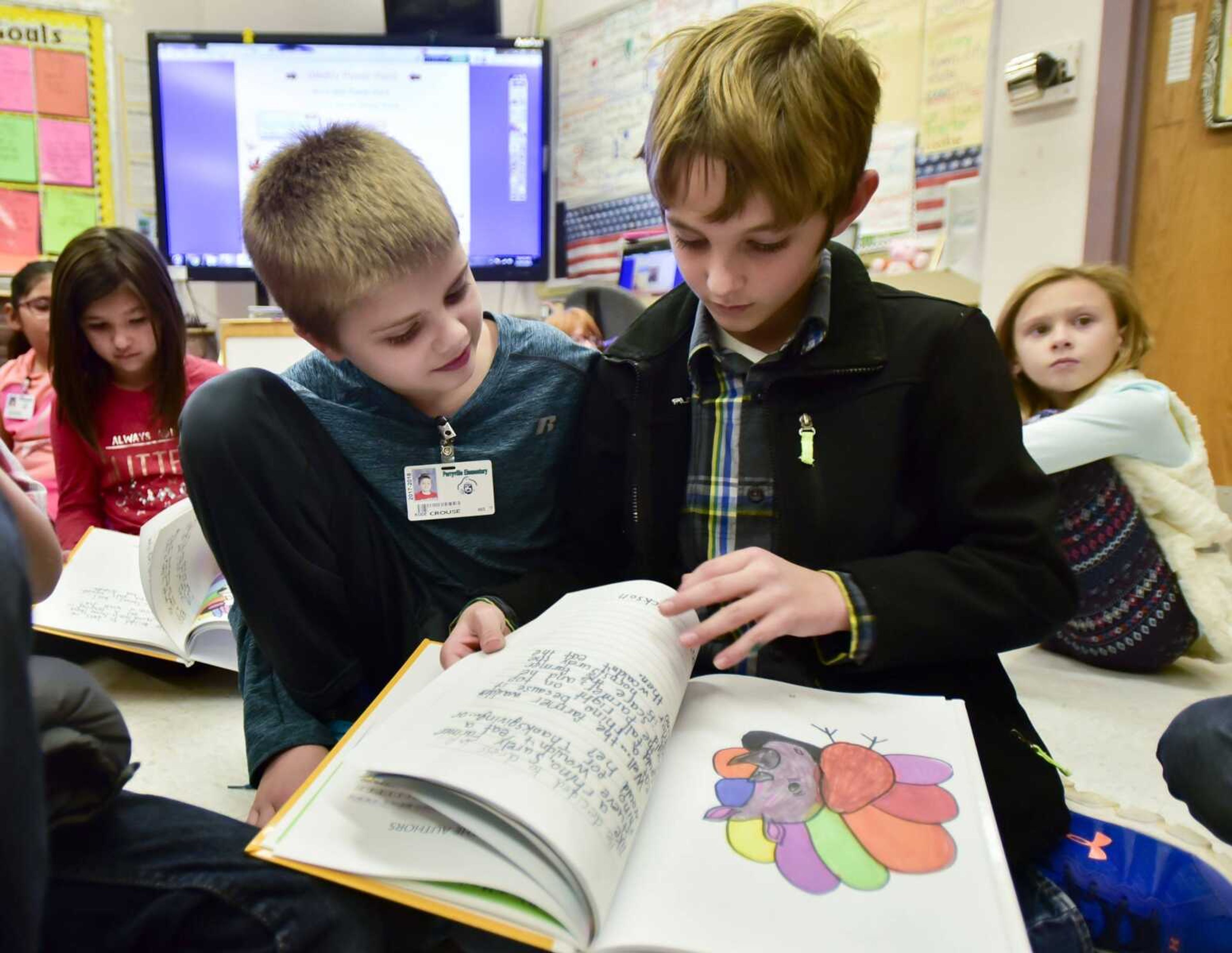 Kode Crouse, left, reads "Turkey's Disguise" with Jackson Stark on Tuesday at Perryville Elementary School in Perryville, Missouri.