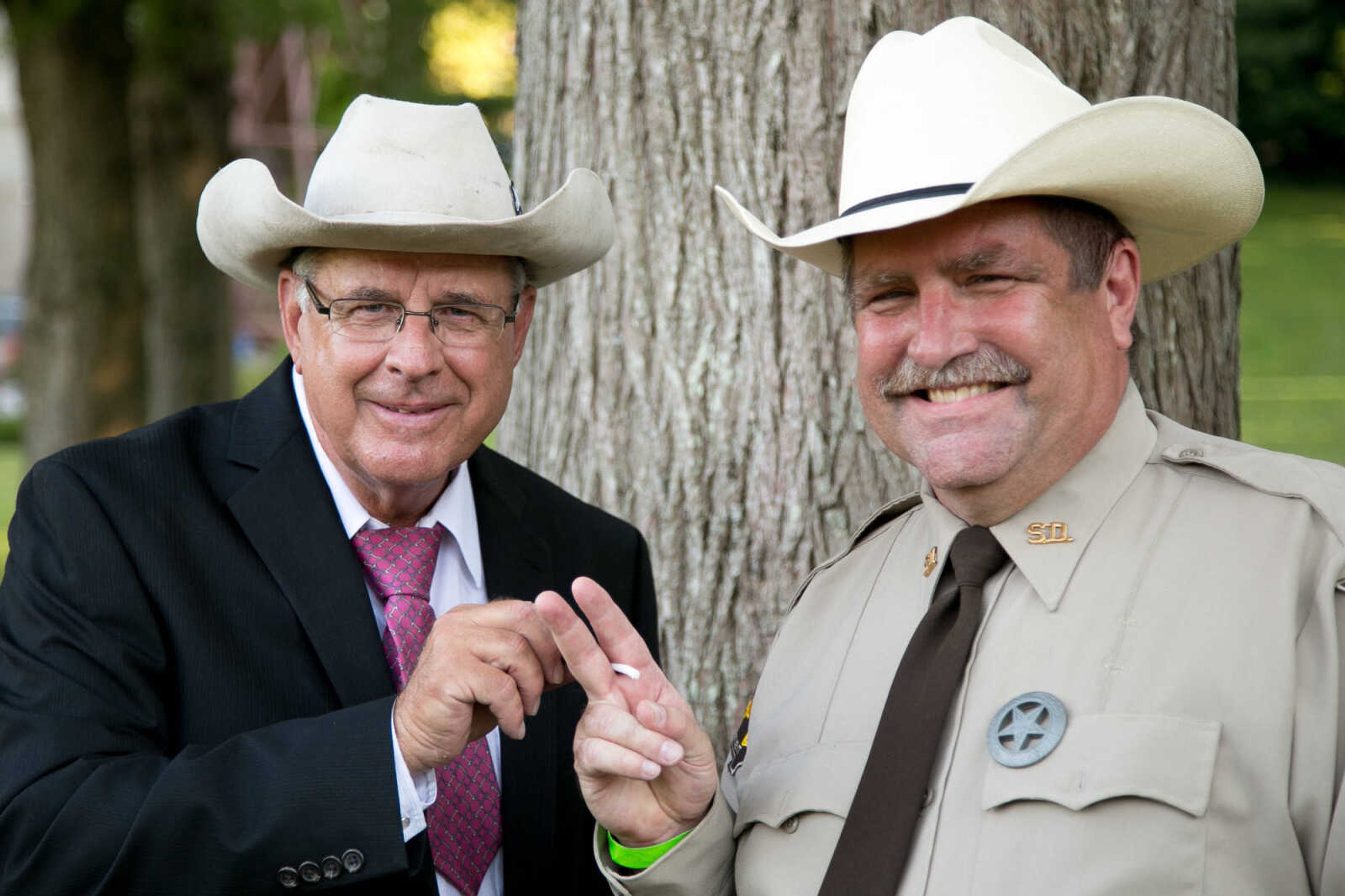 GLENN LANDBERG ~ glandberg@semissourian.com

Charlie Glueck and Jeff Martin pose for a photo during Rockin' the Park at the Jackson City Park Bandshell Saturday, June 11, 2016.