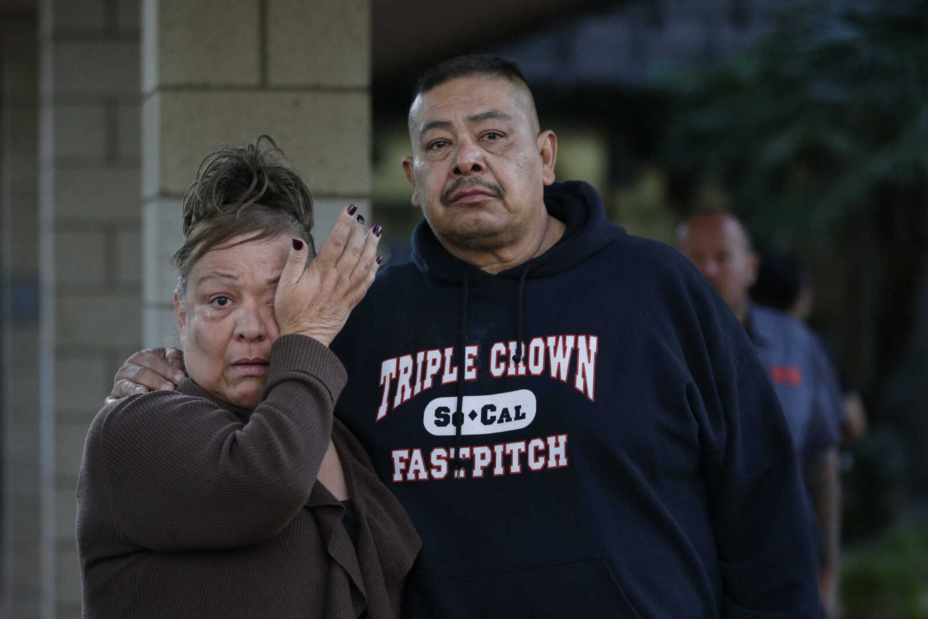 People wait at a community center for a family member who was near a shooting that killed multiple people at a social services center, Wednesday, Dec. 2, 2015, in San Bernardino, Calif. (AP Photo/Jae C. Hong)