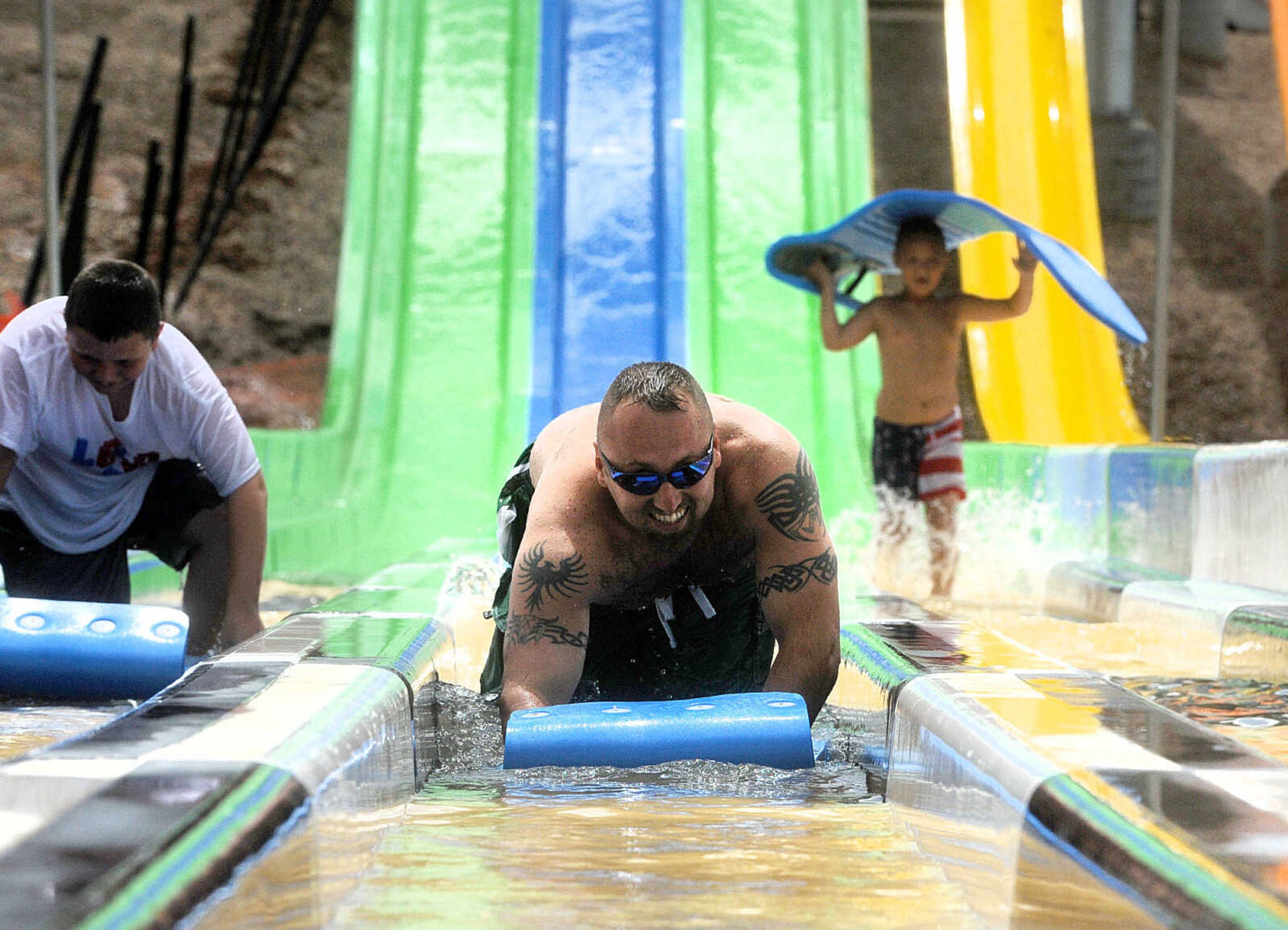 LAURA SIMON ~ lsimon@semissourian.com

The Cape Girardeau Parks and Recreation Department opened the new 265-foot-long free-fall slide, 259-foot-long triple-drop slide and a three-Lane 319-foot-long mat racer with 30-foot tower, at Cape Splash Family Aquatic Center, Thursday, July 9, 2015.