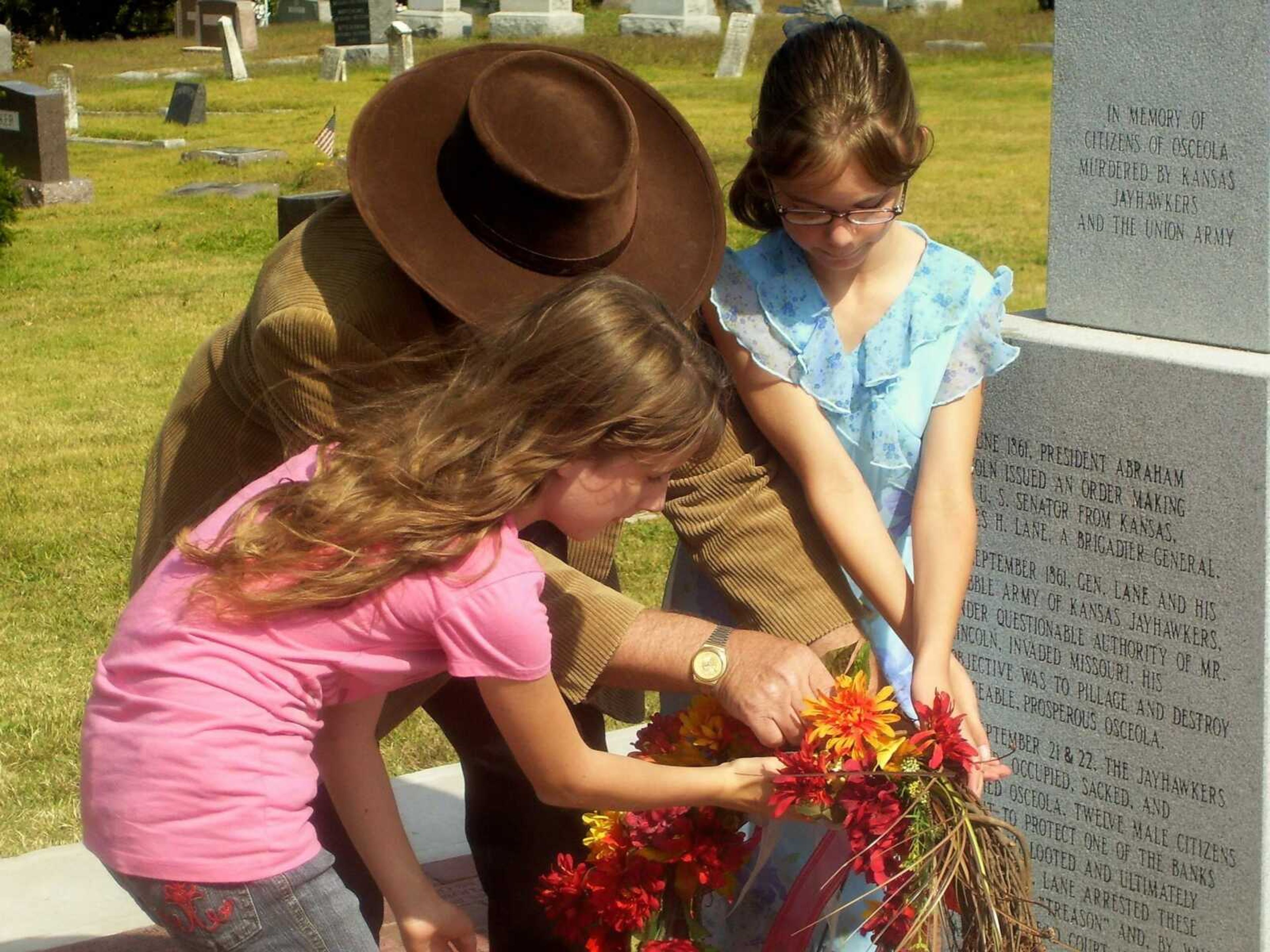 Alexandria Lacy (from Marble Hill, Missouri) and Catylin Adamson (from Humansville, Missouri) presenting the dedication wreath to the Monument to Osceola, Missouri's murdered citizens on October 11th, 2008.