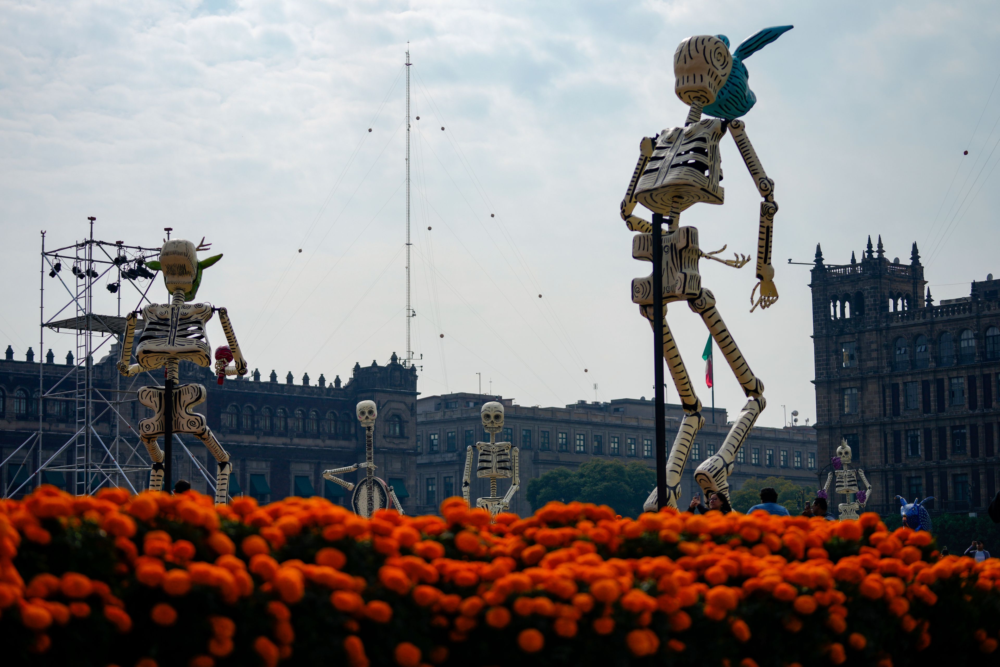 Calaveras tower over Day of the Dead altars in the Zocalo, the main plaza in Mexico City, Thursday, Oct. 31, 2024. (AP Photo/Moises Castillo)