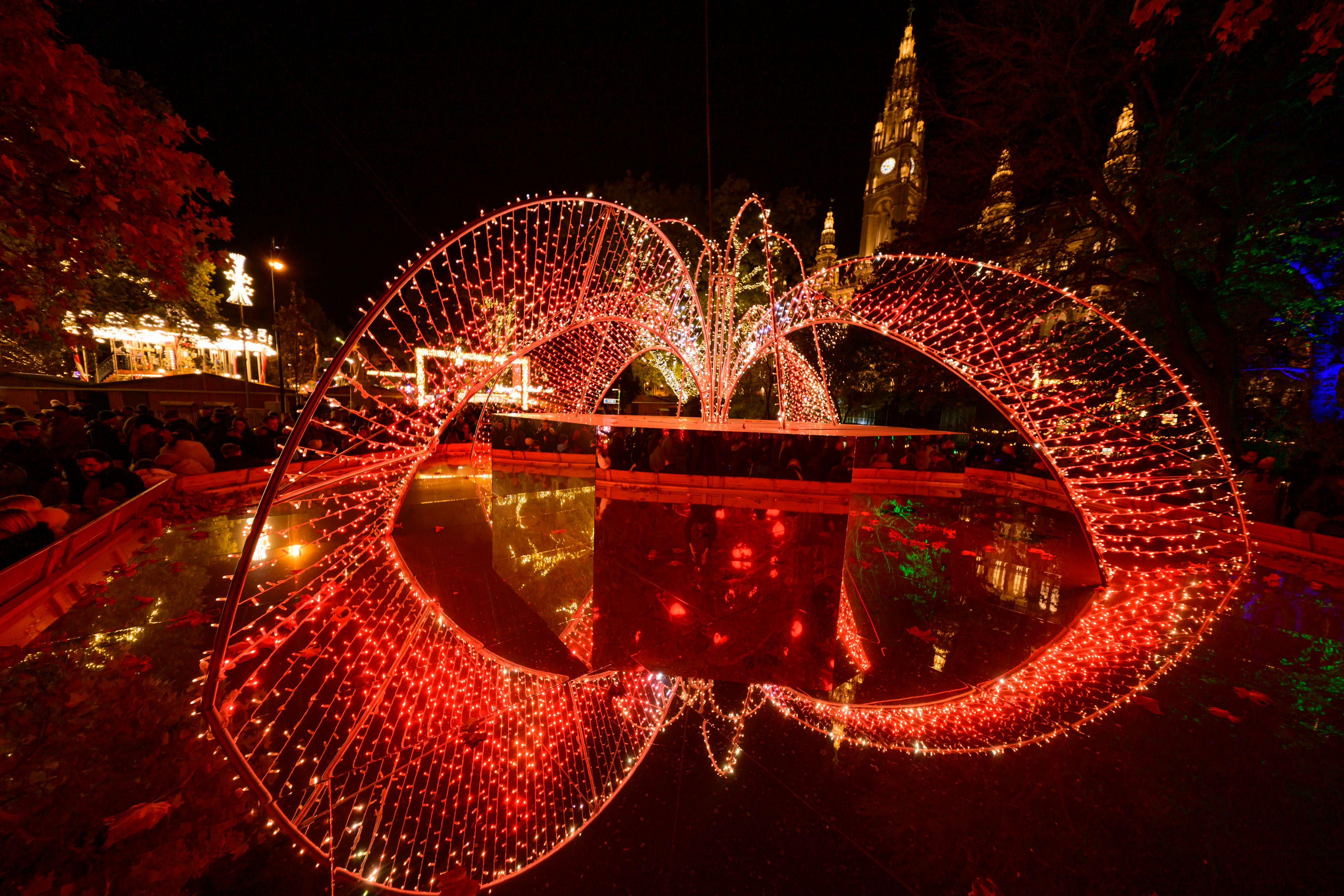 Illuminations of the Wiener Chritkindlmarkt in front of Vienna's city hall, one of Vienna's most popular Christmas markets, in Vienna, Austria, Saturday, Nov. 16, 2024. (AP Photo/Christian Bruna)