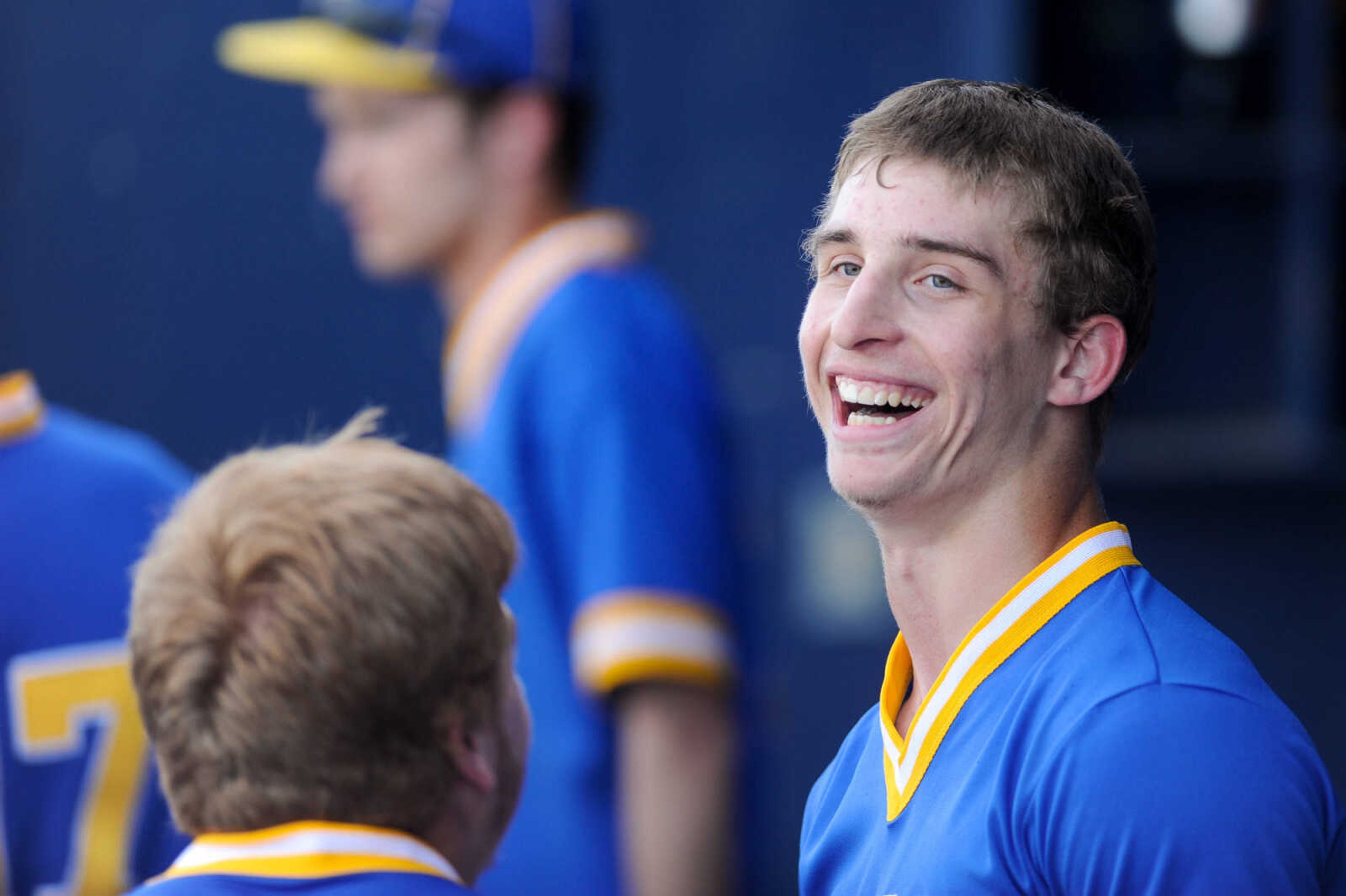 Scott City's Trent Pobst is congratulated by teammates in the dugout after his two-run homer in the sixth inning against Notre Dame Tuesday, April 19, 2016 at Notre Dame Regional High School.