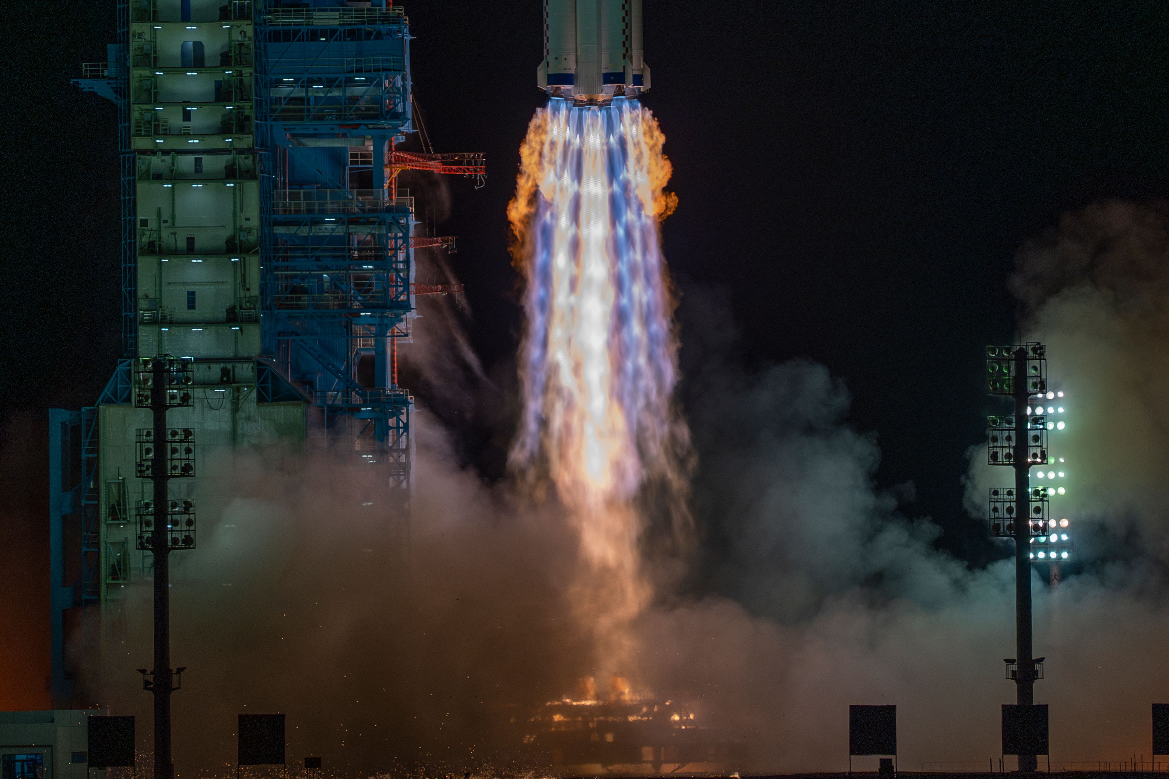 A Long March rocket with a Shenzhou-19 spacecraft atop takes off from the Jiuquan Satellite Launch Center in Jiuquan, northwestern China in the early hours of Wednesday, Oct. 30, 2024. (AP Photo/Ng Han Guan)