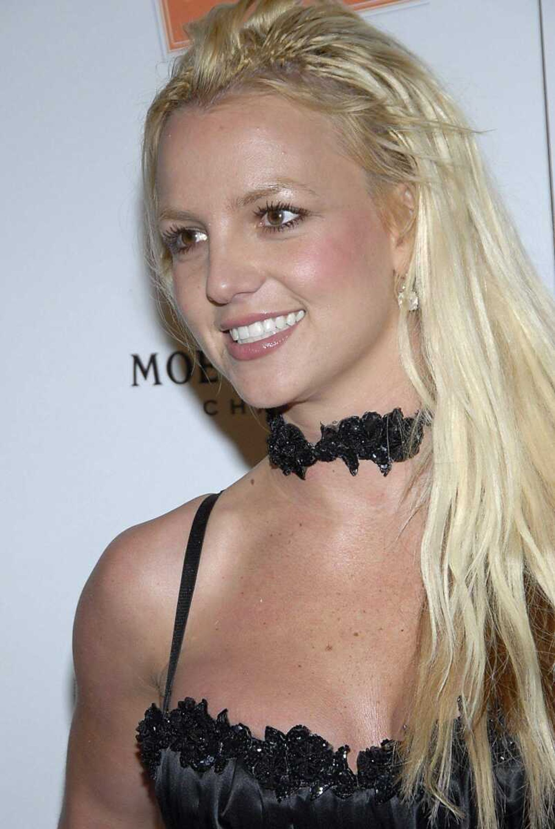 Singer Britney Spears poses on the press line at the Scandinavian Style Mansion party in Los Angeles in this Dec. 1, 2007 file photo. The attorney for Britney Spears' ex-husband said Friday, Dec. 14, he plans to ask the court to punish the pop star for calling in sick to her court-ordered deposition on Dec. 12. Mark Vincent Kaplan, who represents Kevin Federline in the custody battle over the couple's two toddlers, said he would be back in court within a month to ask for sanctions.  (AP Photo/Dan Steinberg, file)