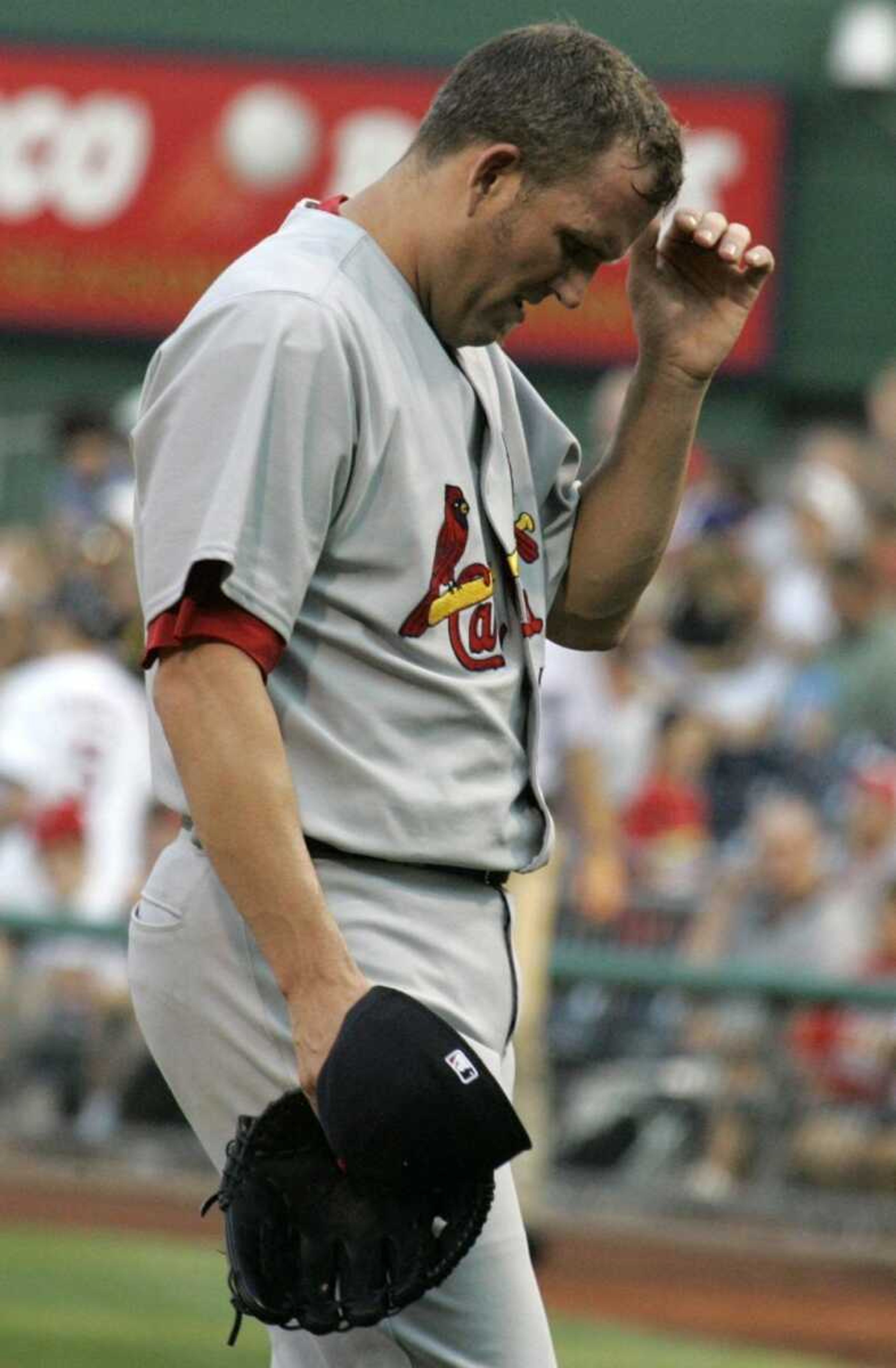 Cardinals pitcher Braden Looper walked to the dugout after giving up a grand slam to Pittsburgh's Ronny Paulino during Wednesday's game in Pittsburgh. (Gene J. Puskar ~ Associated Press)