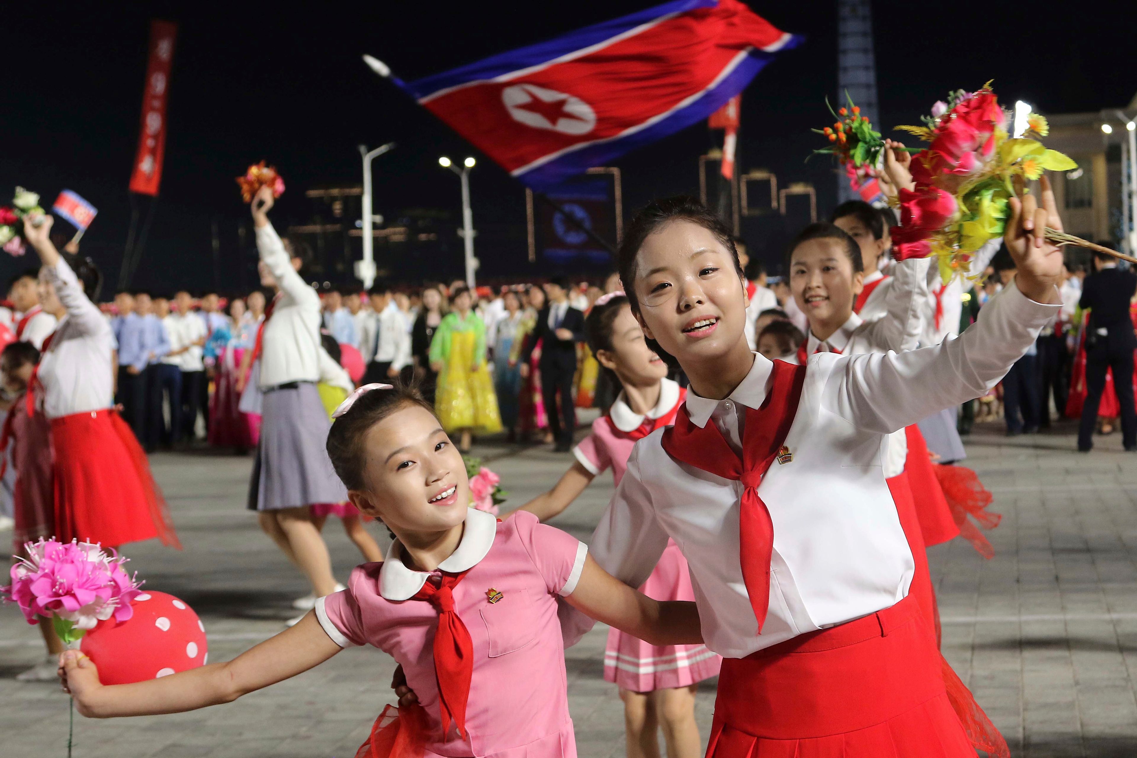 North Korean dance during an evening gala as they celebrate the country's 76th founding anniversary at Kim Il Sung Square in Pyongyang, North Korea Sunday, Sept. 8, 2024. (AP Photo/Jon Chol Jin)