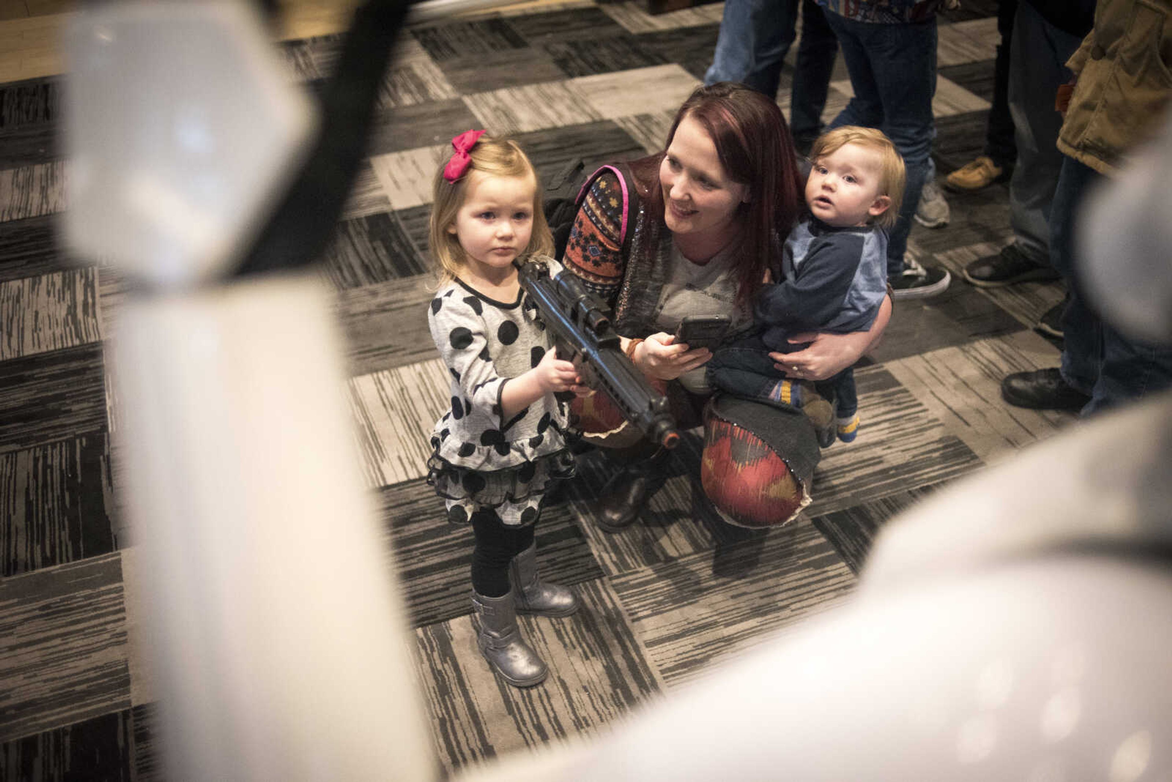 Ealyn Taylor, 3, holds up a blaster towards a stormtrooper with her mother Amber Taylor and brother Euriah Taylor , 1, before showing of Star Wars: The Last Jedi Thursday, Dec. 14, 2017 at Cape West Cinema in Cape Girardeau.