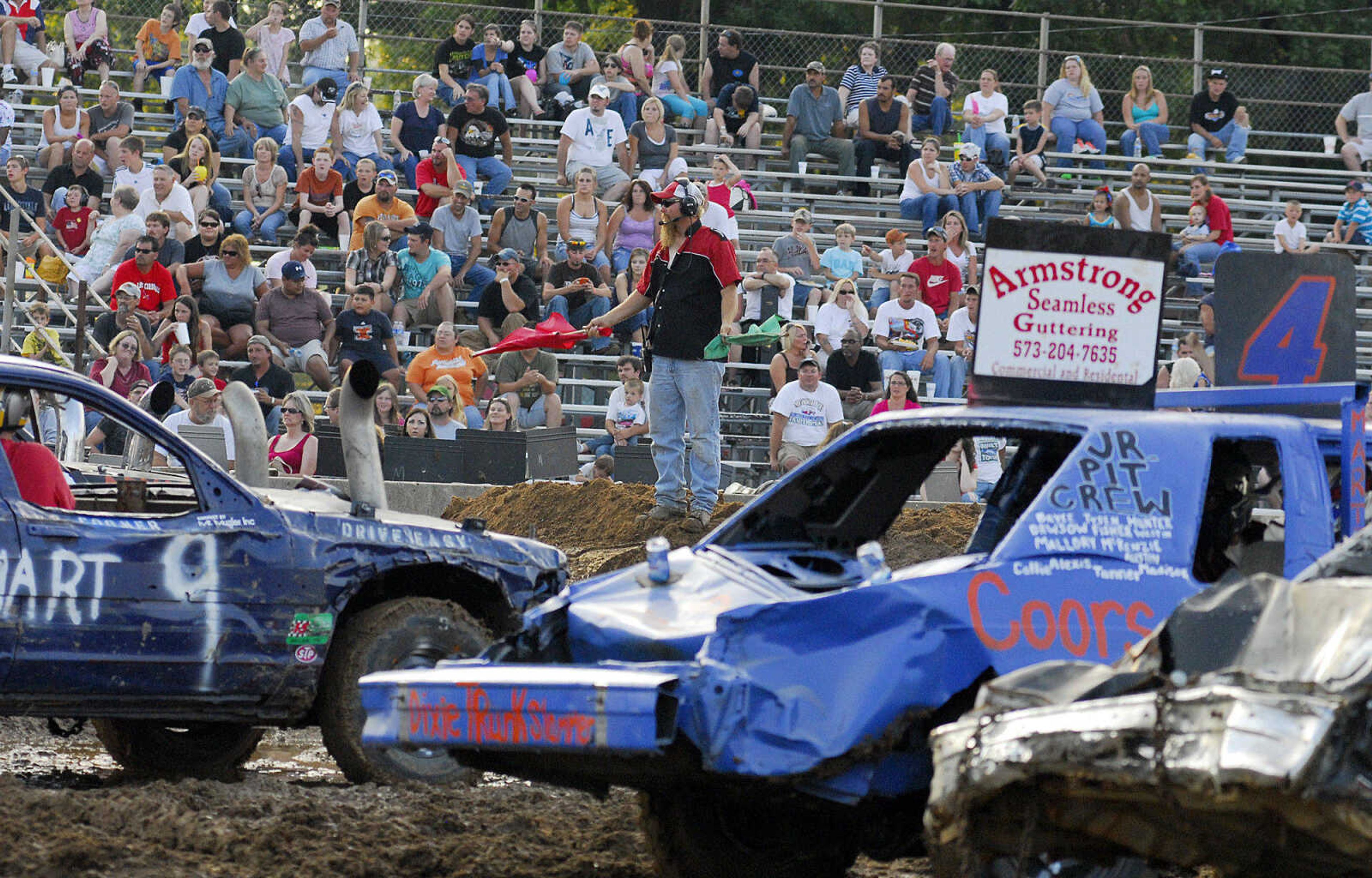 LAURA SIMON~lsimon@semissourian.com
Let the dual demolition derby begin during the U.S.A. Veterans Fourth of July celebration at Arena Park in Cape Girardeau Sunday, July 4, 2010.