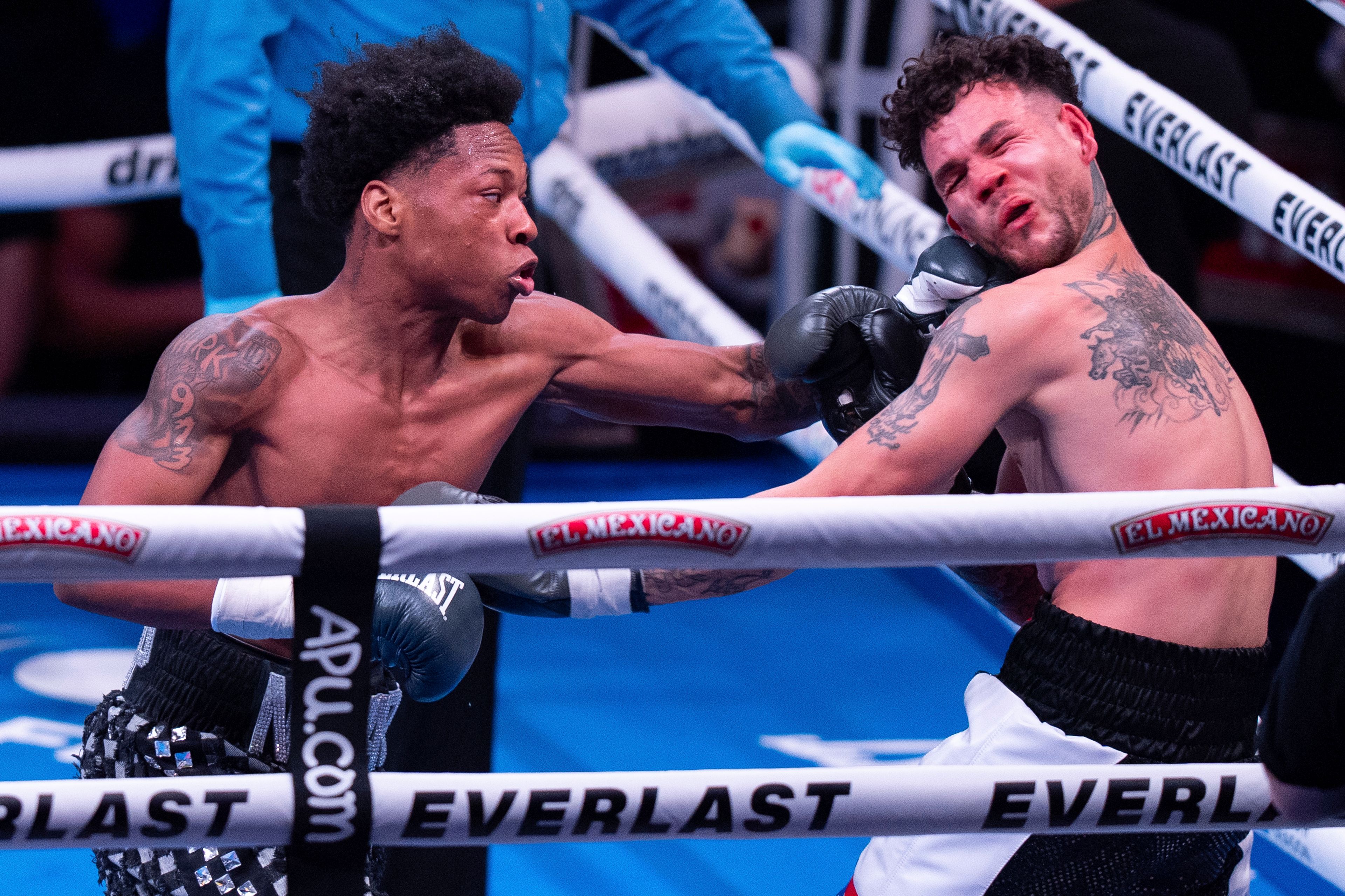 Zaquin Moses, left connects with a punch against Michael Ruiz, right, during the fourth round of a Super-Featherweight bout Saturday, Nov. 9, 2024, in Philadelphia. Zaquin Moses win by unanimous decision. (AP Photo/Chris Szagola)