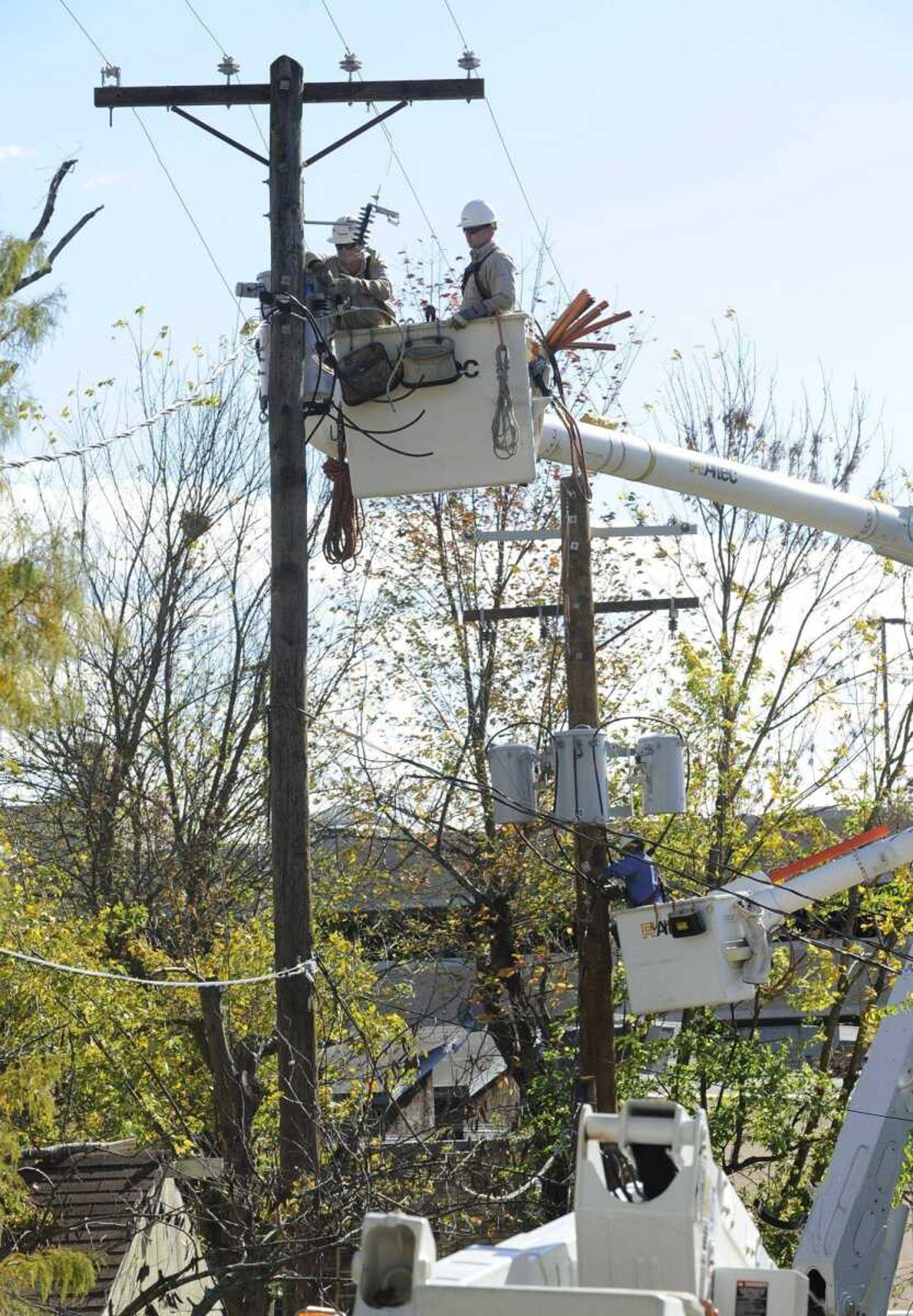 Ameren workers repair power lines between Penny and Whitelaw avenues Tuesday, Oct. 26, 2010 after overnight storm damage. (Fred Lynch)