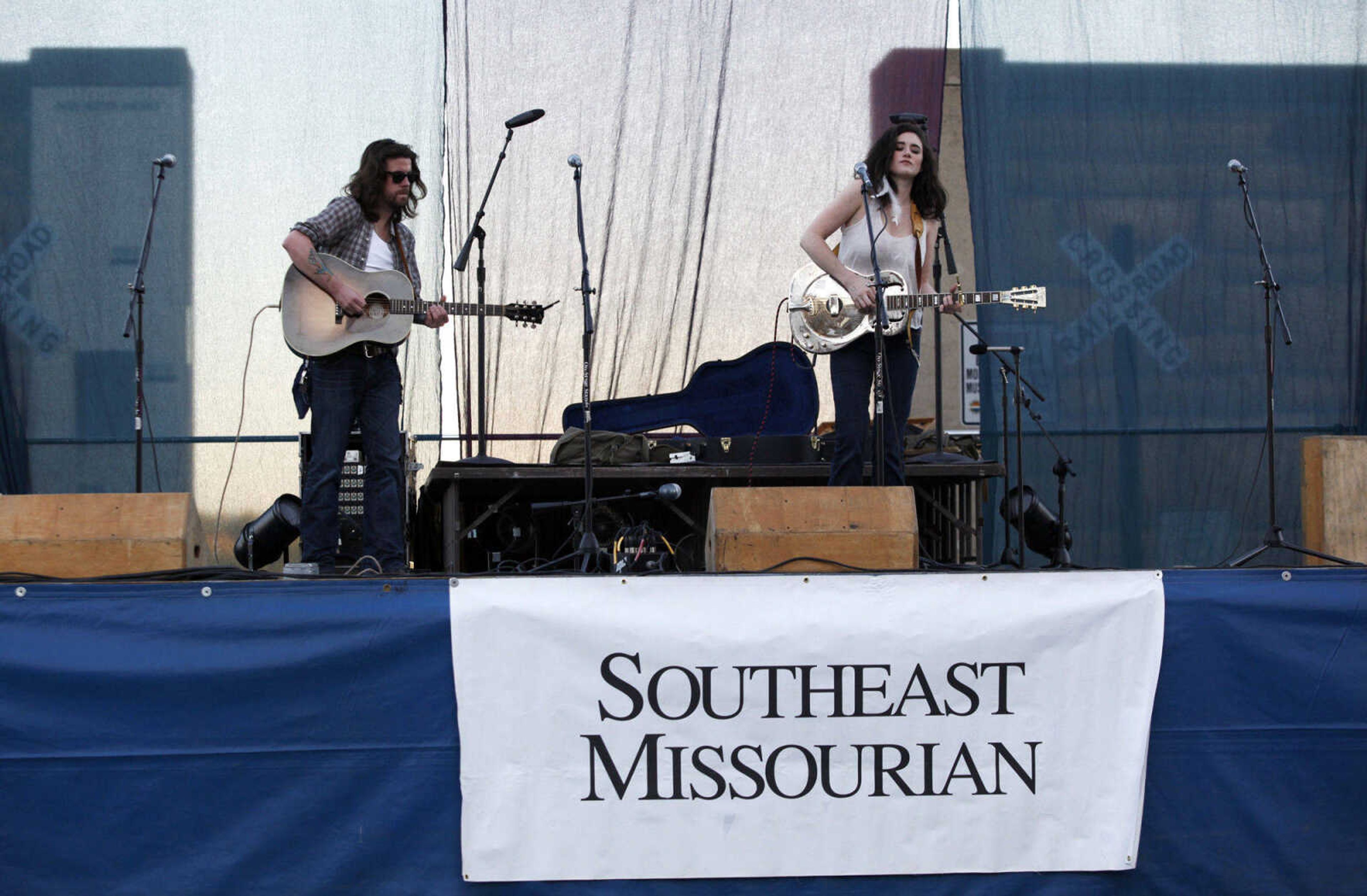 CHRIS MACKLER ~ photos@semissourian.com

Jeremy Stanfill (left) and Grace Askew, both of Memphis, perform on the main stage at the 14th annual River City Music Festival held in downtown Cape Girardeau on Friday, Oct. 1, 2010.