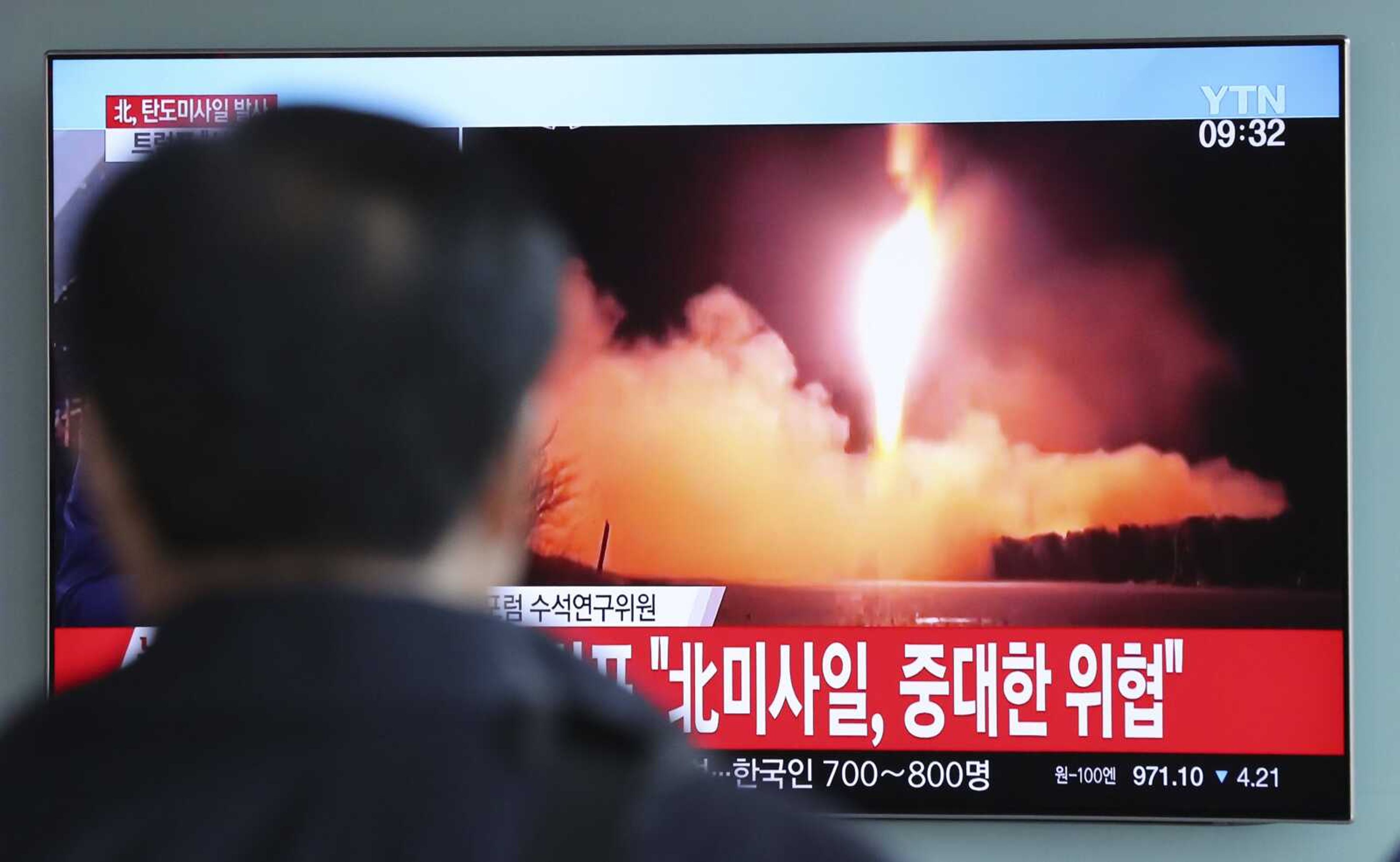 A man at the Seoul Railway Station in Seoul, South Korea,watches a local news program reporting North Korea's latest missile launch Wednesday. The letters read, "North Korea's missile launch, serious threat."