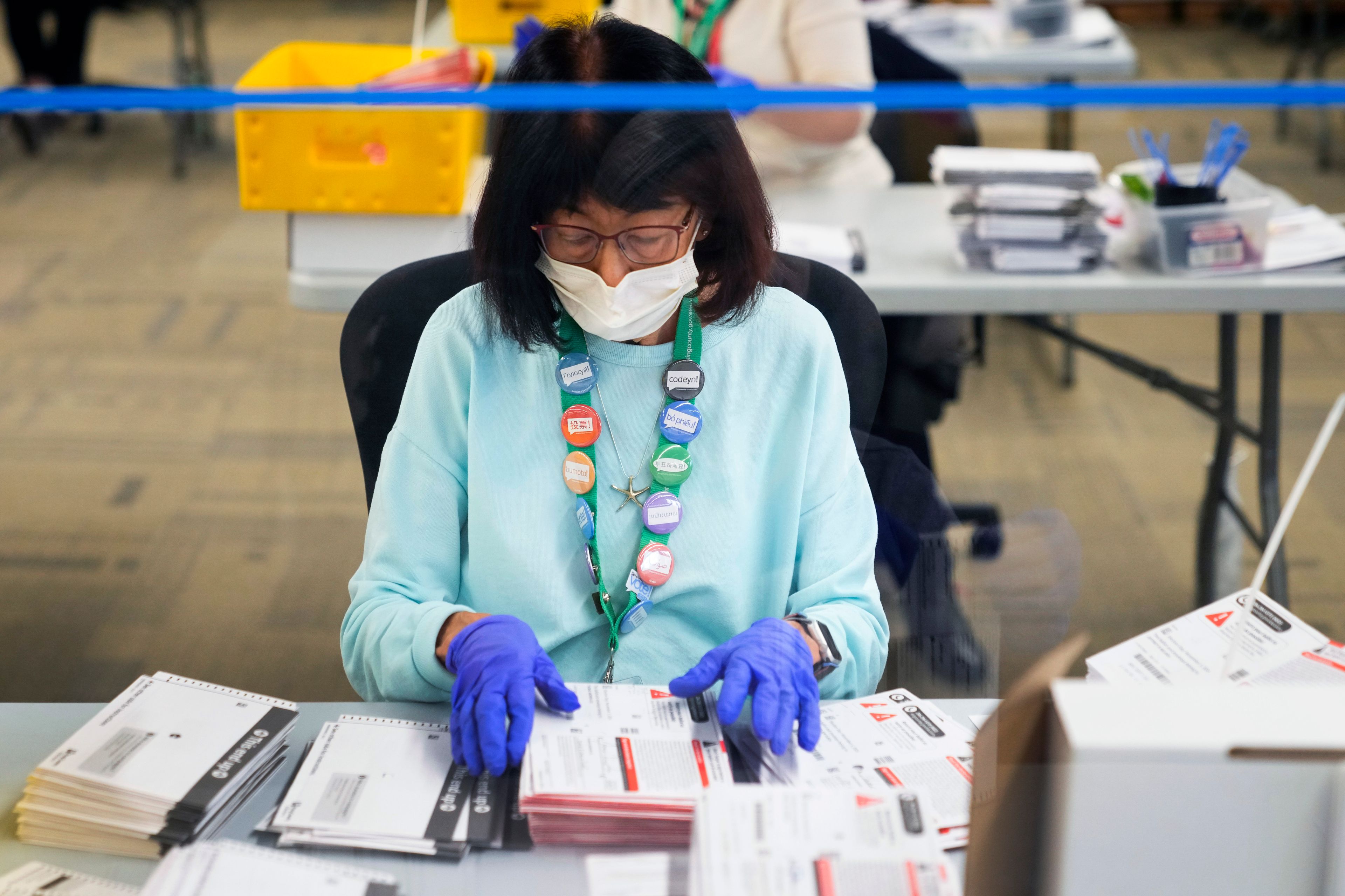 Betty Noro-Kobayashi works to open ballots at King County Elections headquarters on Election Day, Tuesday, Nov. 5, 2024, in Renton, Wash. (AP Photo/Lindsey Wasson)