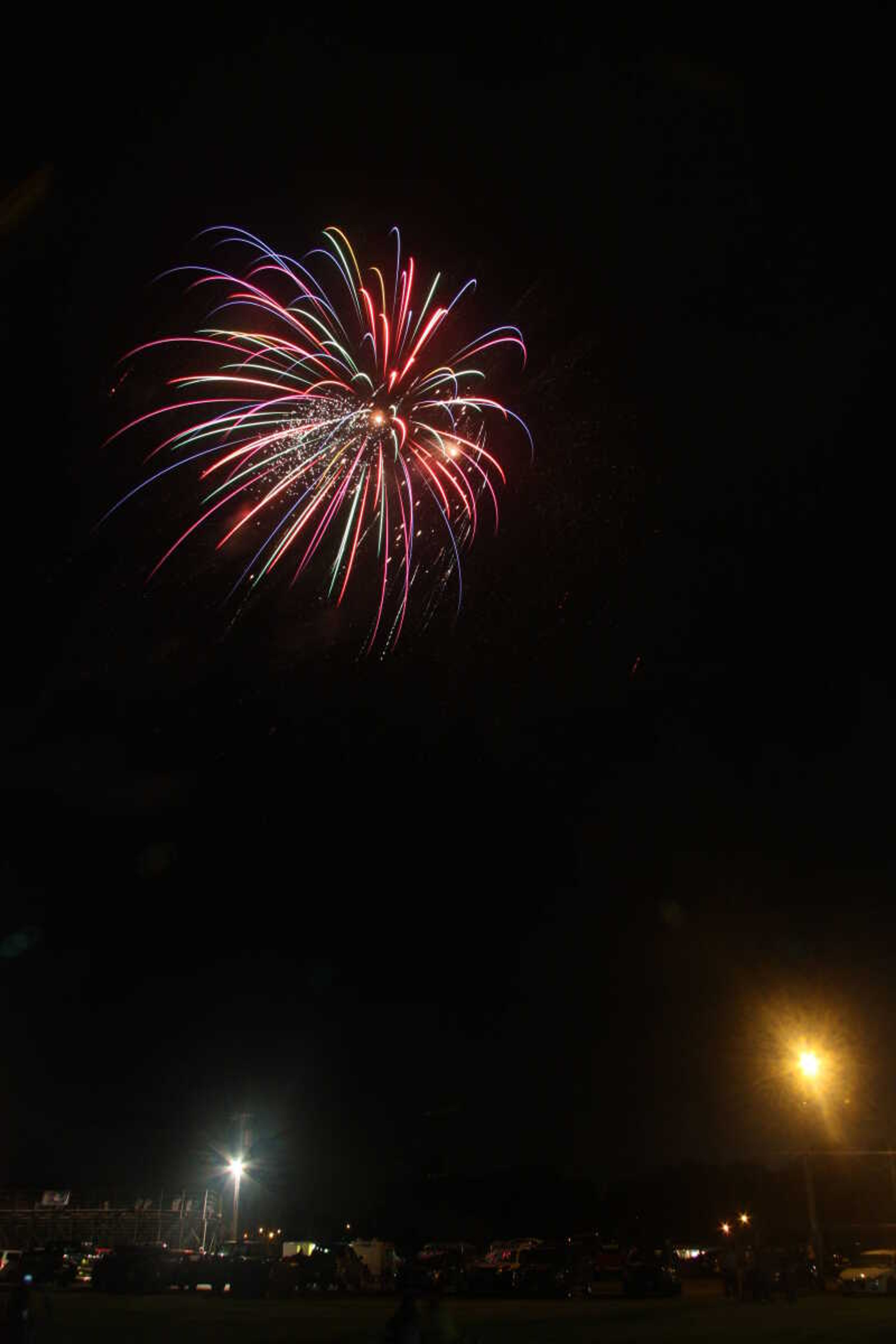 Picture of the fireworks display in Cape Girardeau's Arena Park, taken from a field south of the park.