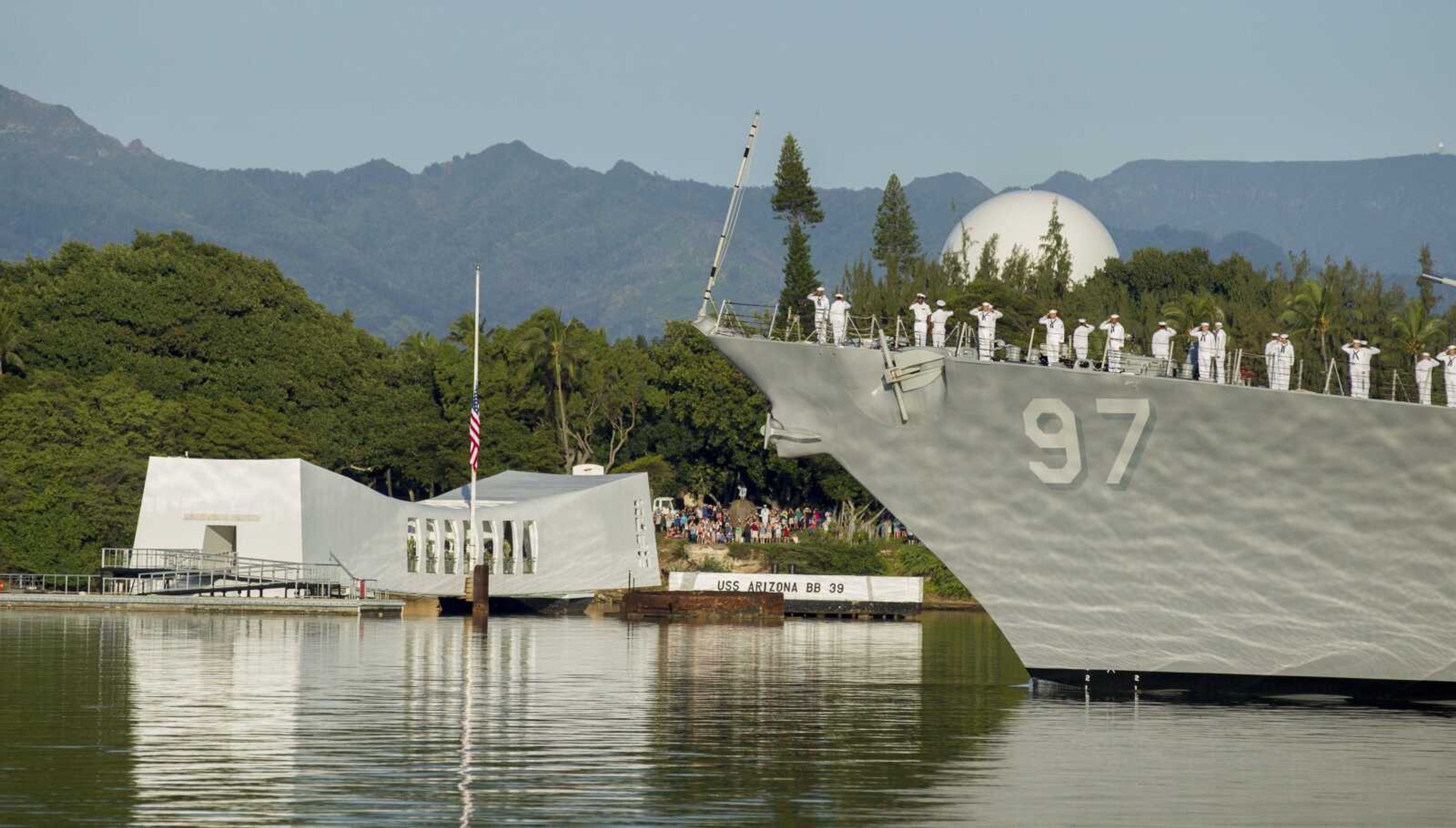 The USS Halsey passes before the USS Arizona Memorial during a moment of silence Wednesday at Joint Base Pearl Harbor-Hickam in Honolulu. Survivors of the Japanese attack, dignitaries and ordinary citizens attended a ceremony at Kilo Pier to commemorate the 75th anniversary of the Japanese attack on the naval harbor.