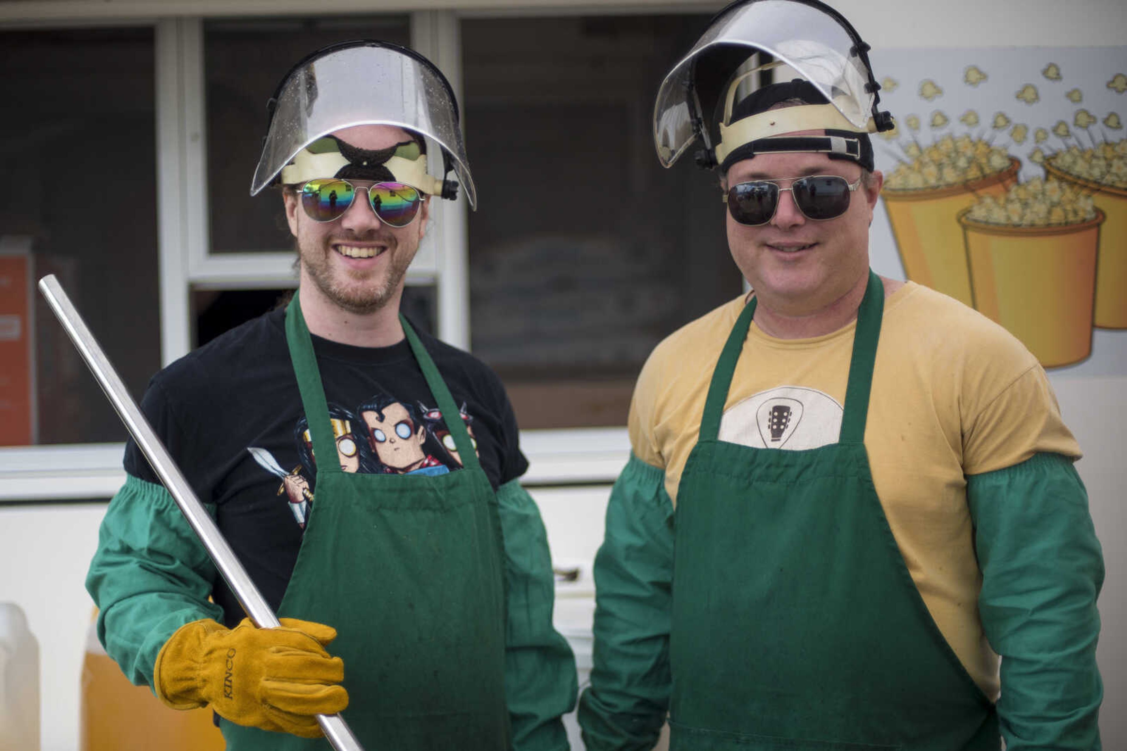 Brandon, left, and Ryan Emmett pose for a photo while making kettle corn during the East Perry County Fair Saturday.