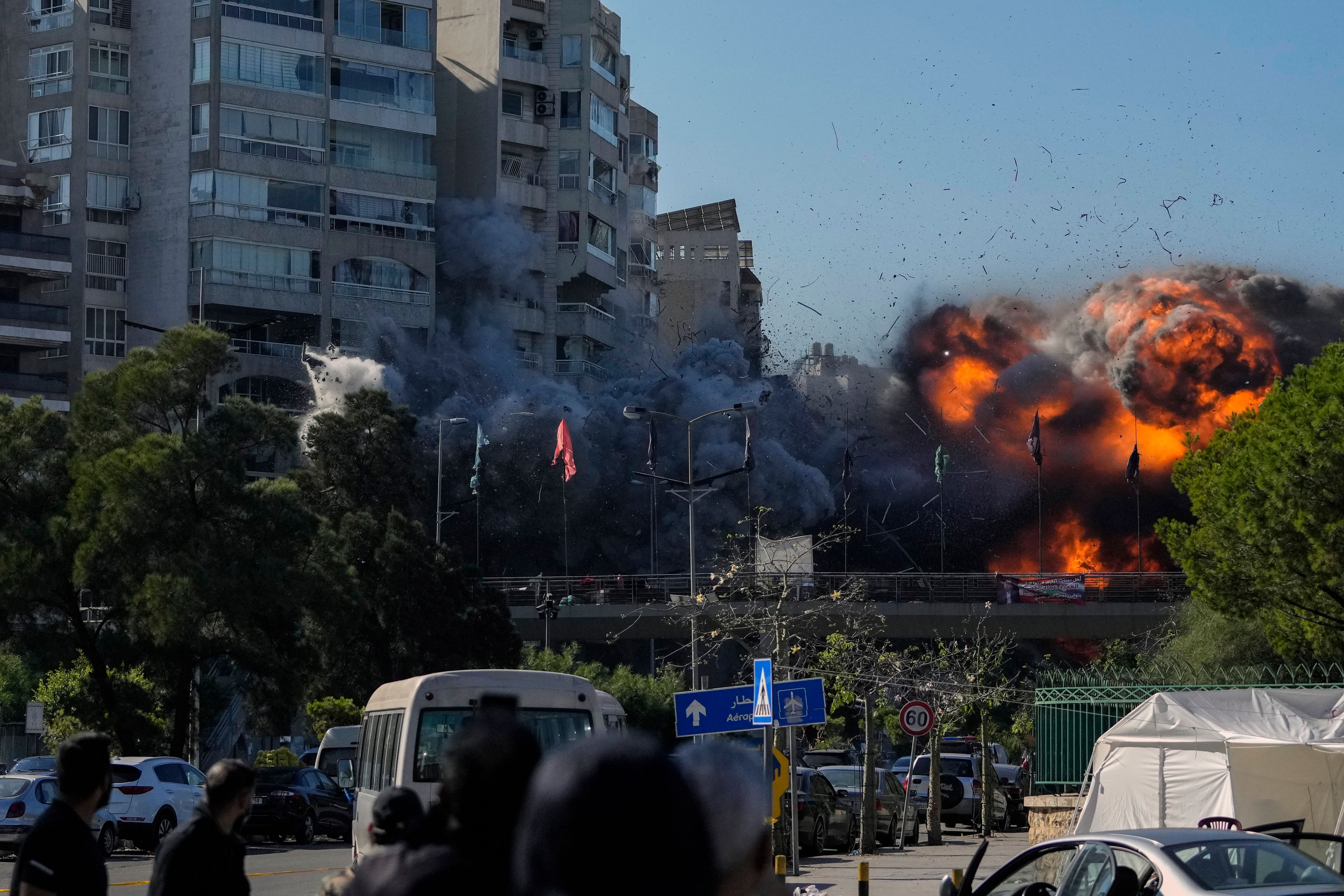 Thick smoke and flames erupt from an Israeli airstrike on Tayouneh, Beirut, Lebanon, Friday, Nov. 15, 2024. (AP Photo/Hassan Ammar)